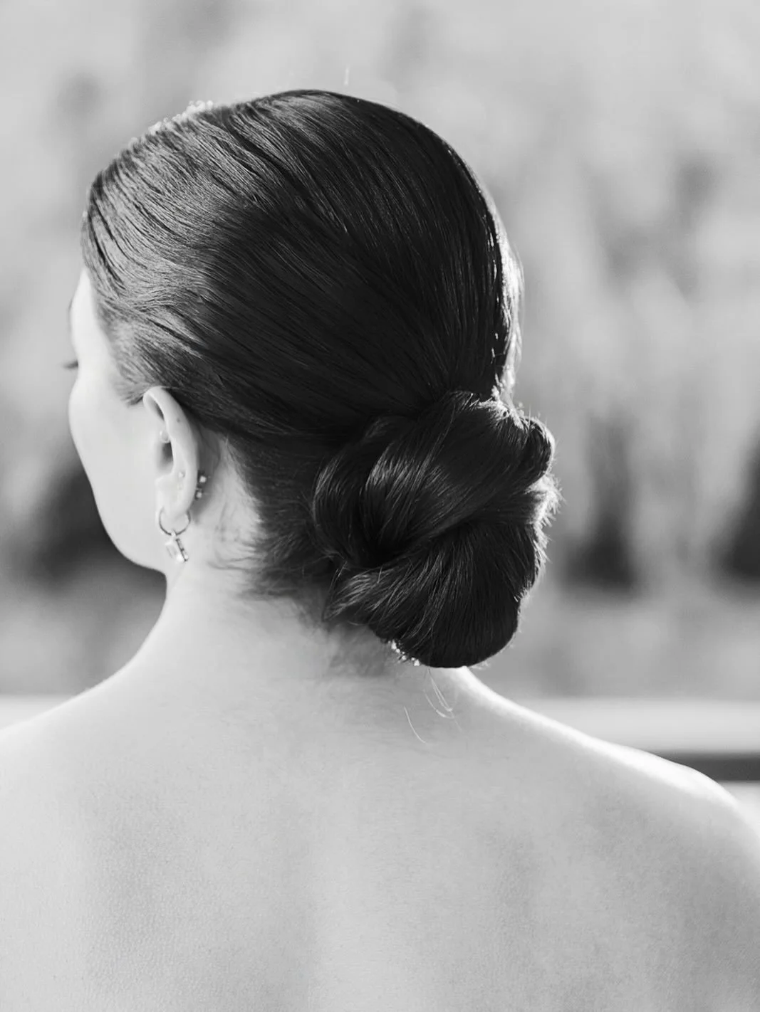 Definitely one of my most requested hairstyles by my brides! A sleek low bun is incredibly versatile, complementing a wide range of wedding gown necklines while maintaining an effortlessly timeless and elegant look.

Whether paired with a romantic la