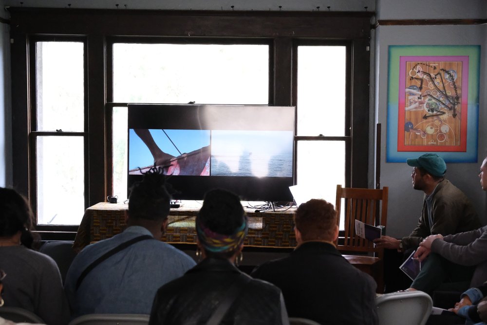  Simon Benjamin speaks to an audience during Wa Na Wari Sunday Dinner screenings.  