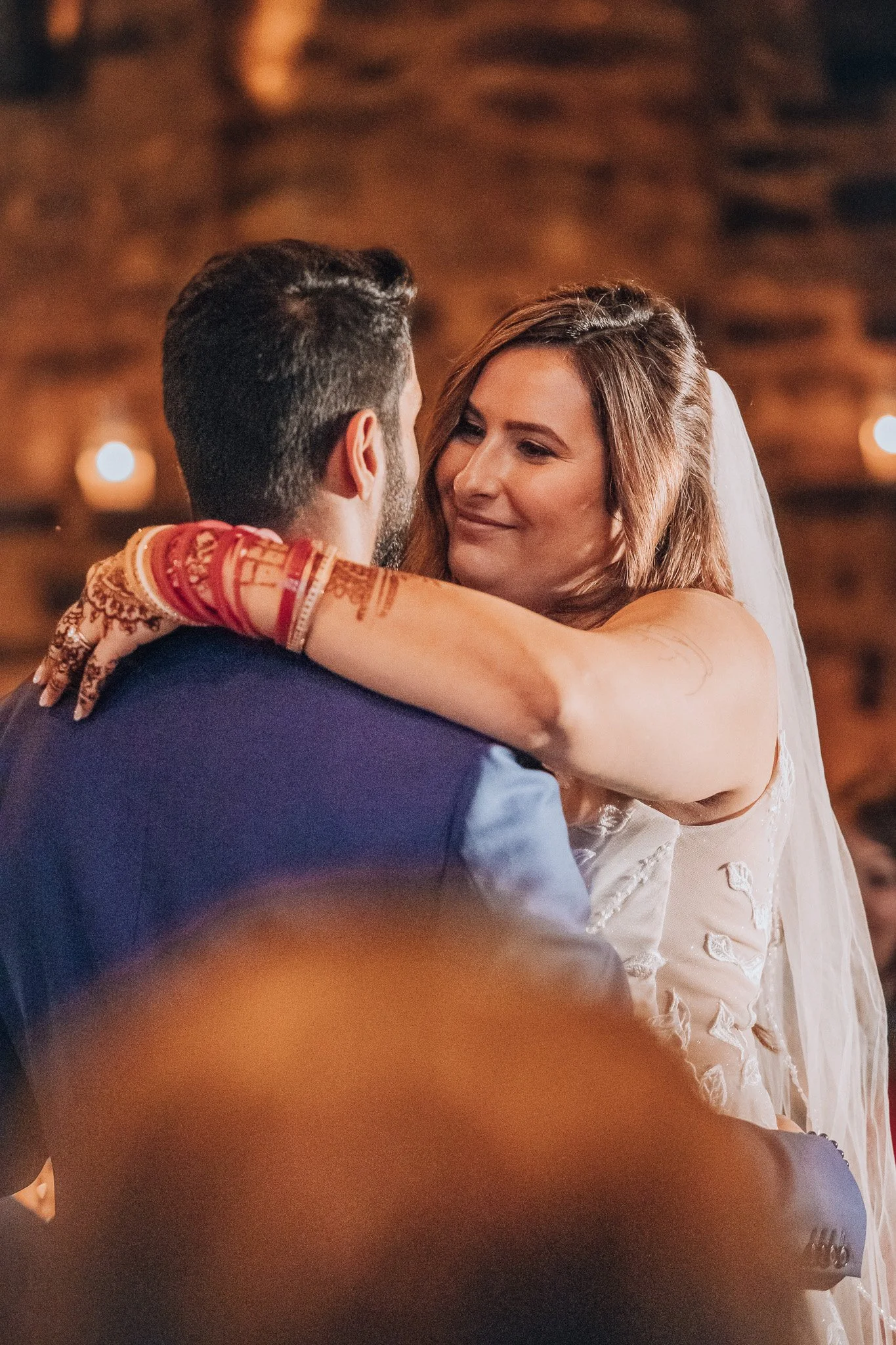 A wedding couple sharing a dance at their reception.