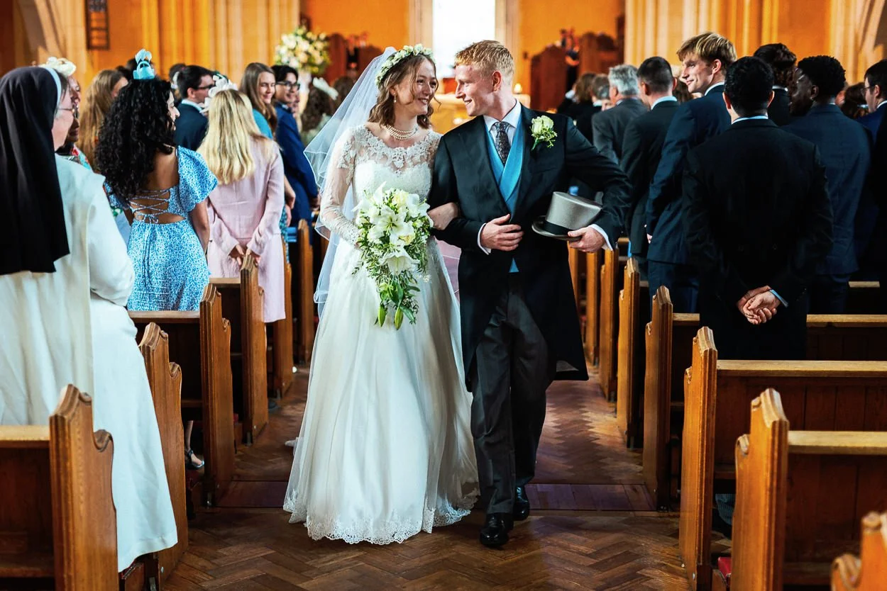 Bride and Groom walk up the aisle as husband and wife