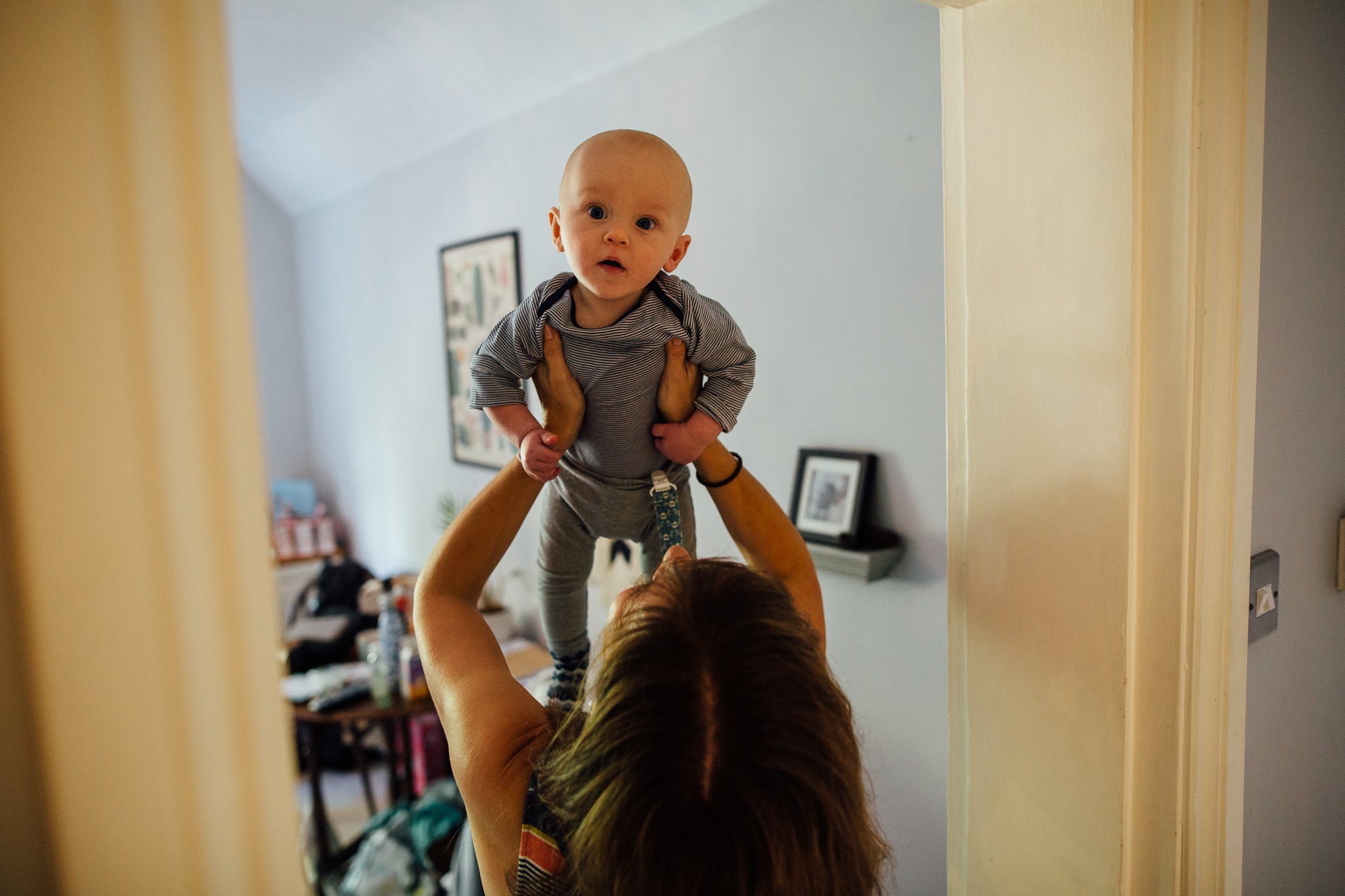  Baby being held aloft 