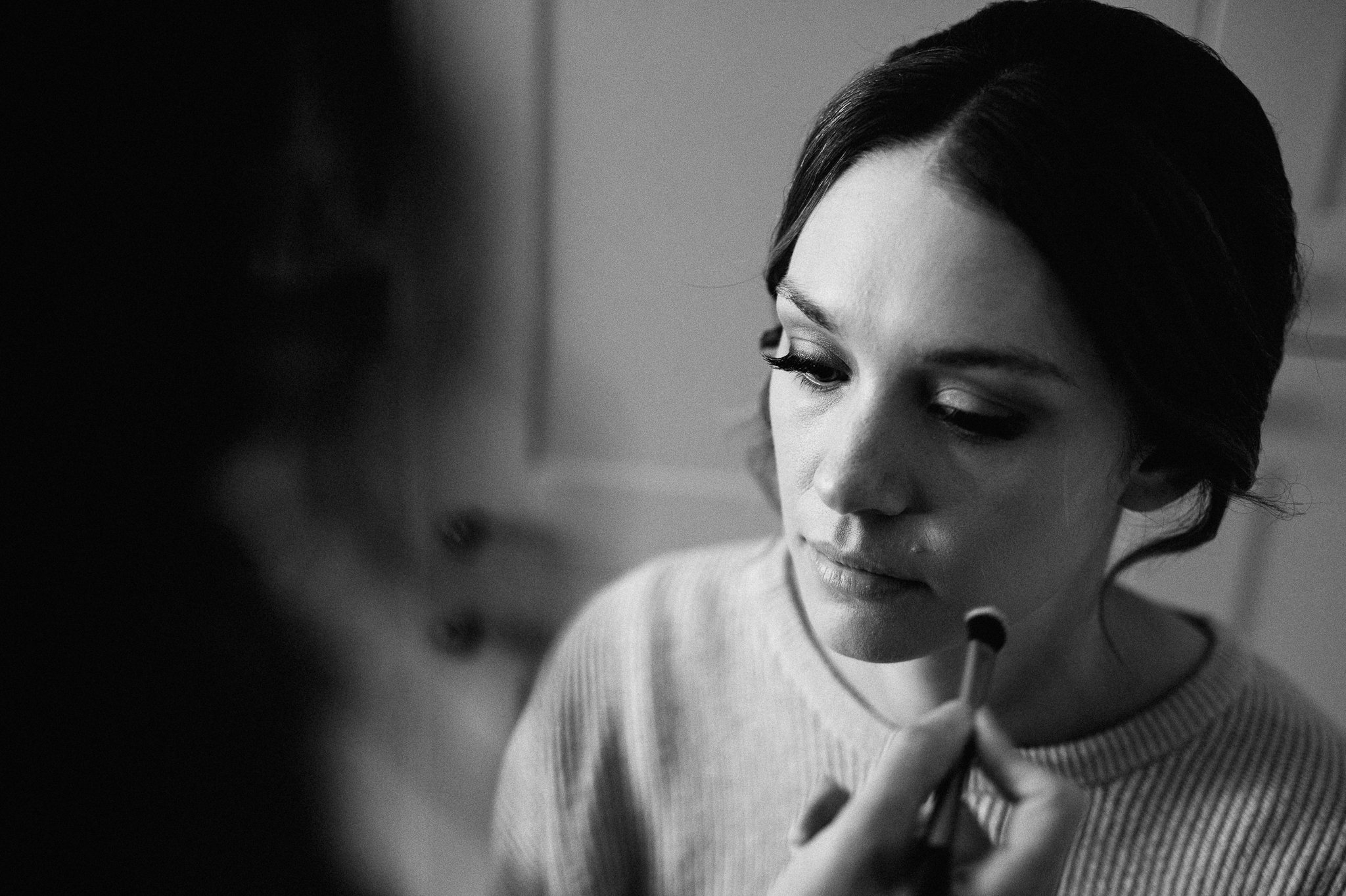  Bride having makeup applied 