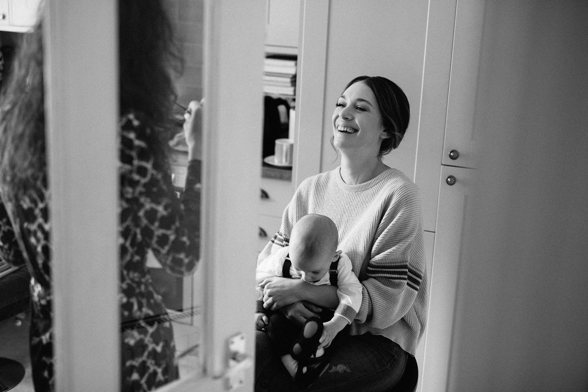  Bride laughing in her kitchen 