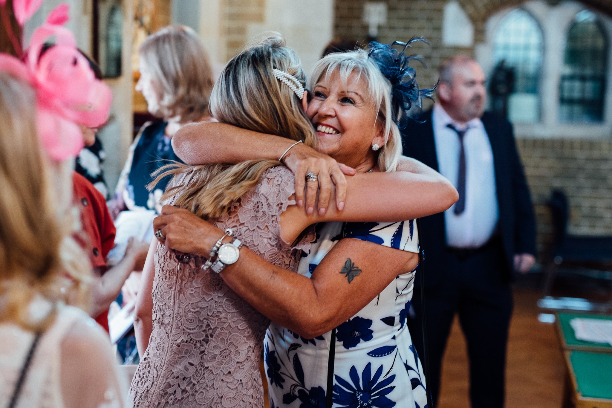  Two female guests hug 