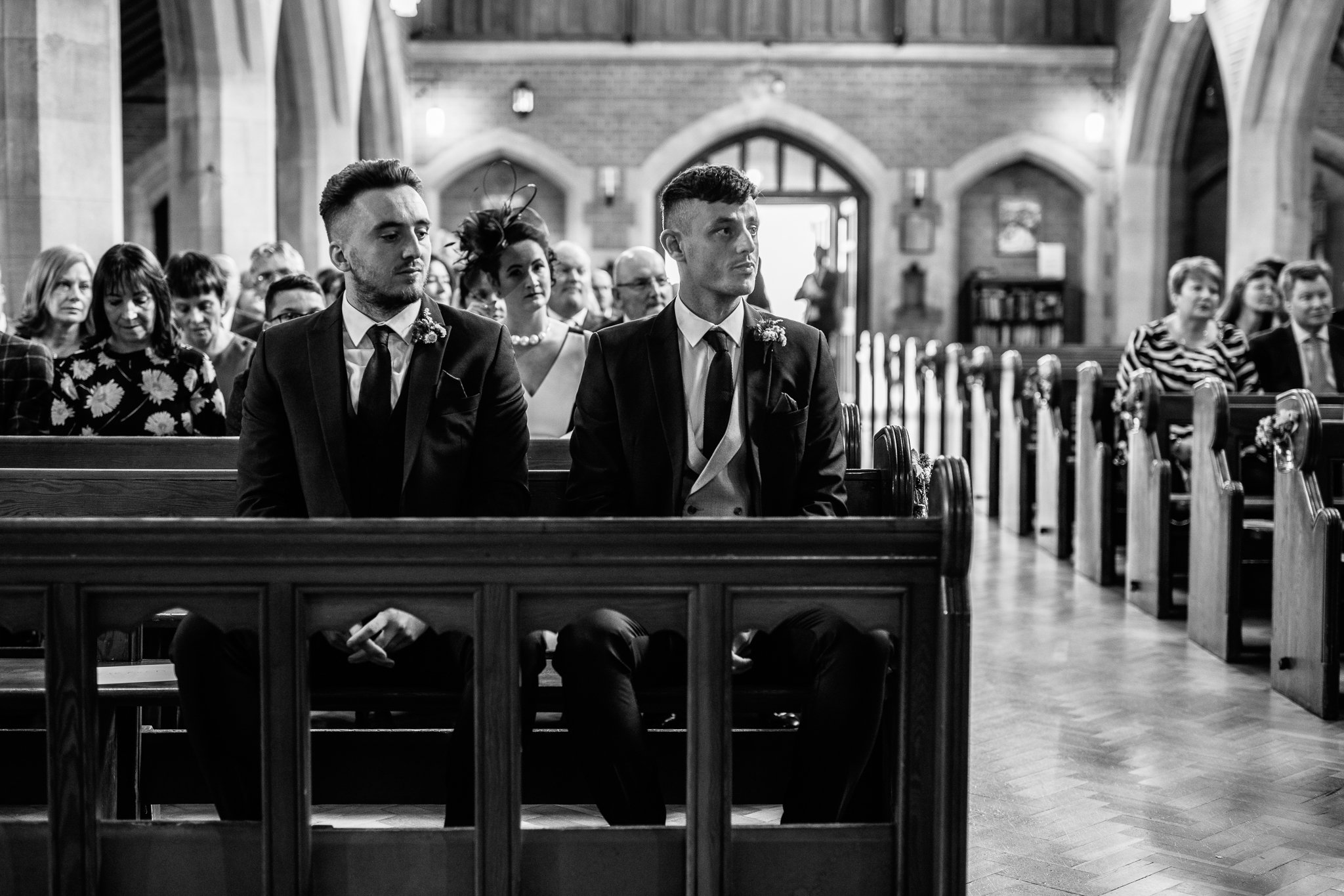  Groom waits nervously for the Bride at The Holy Family Church in Reigate 