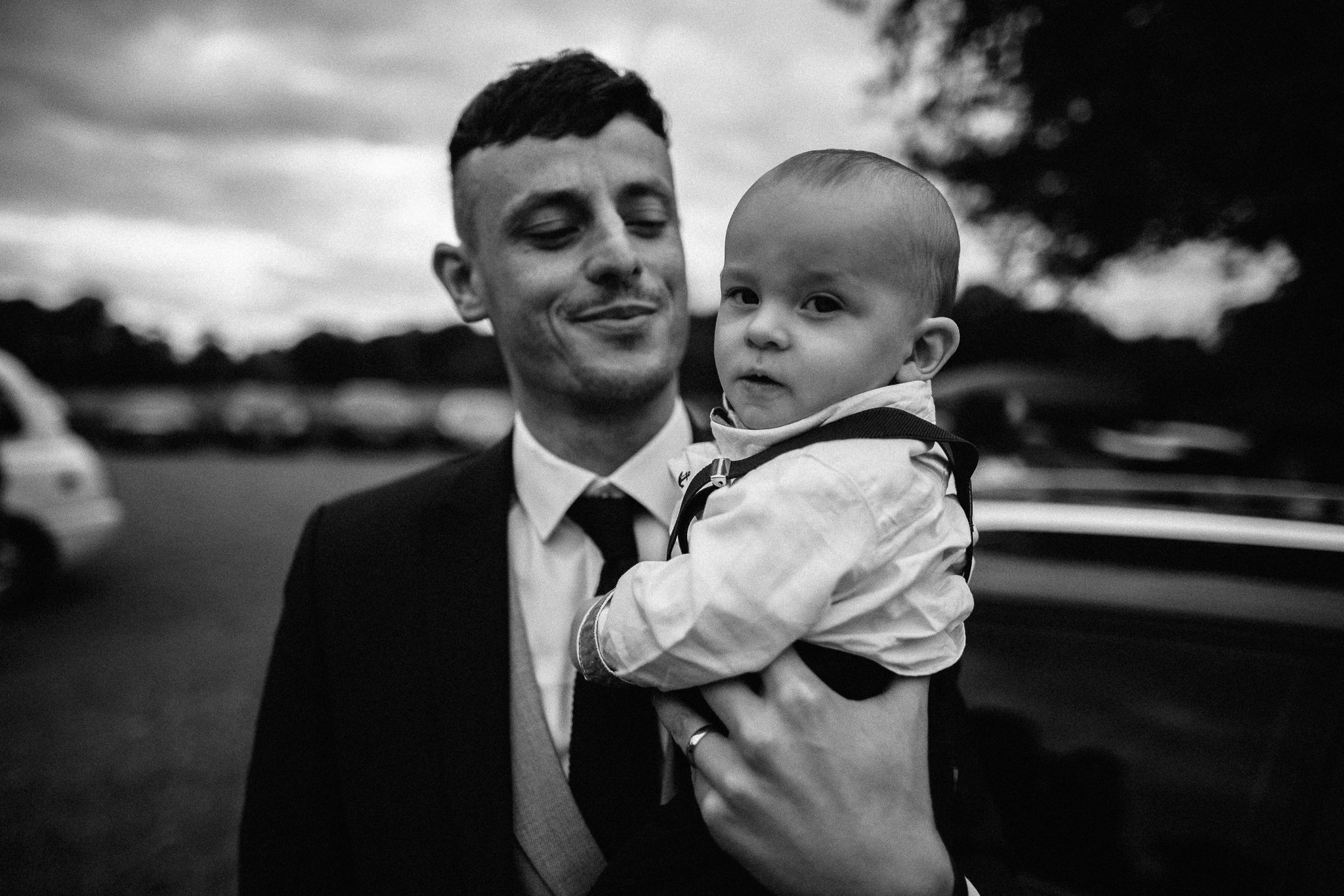  Groom holds his son 