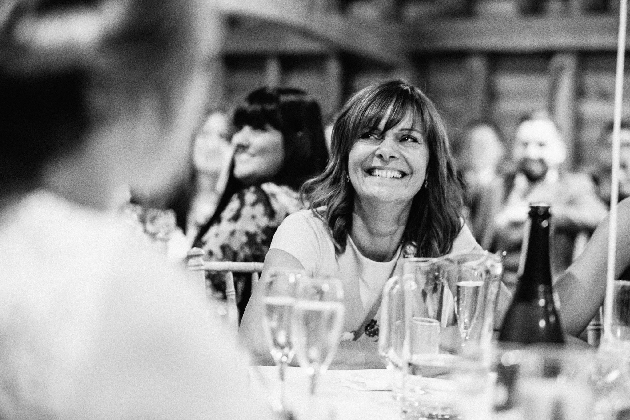  Mother of bride with a big smile on her face at Gildings Barns in Newdigate Surrey 