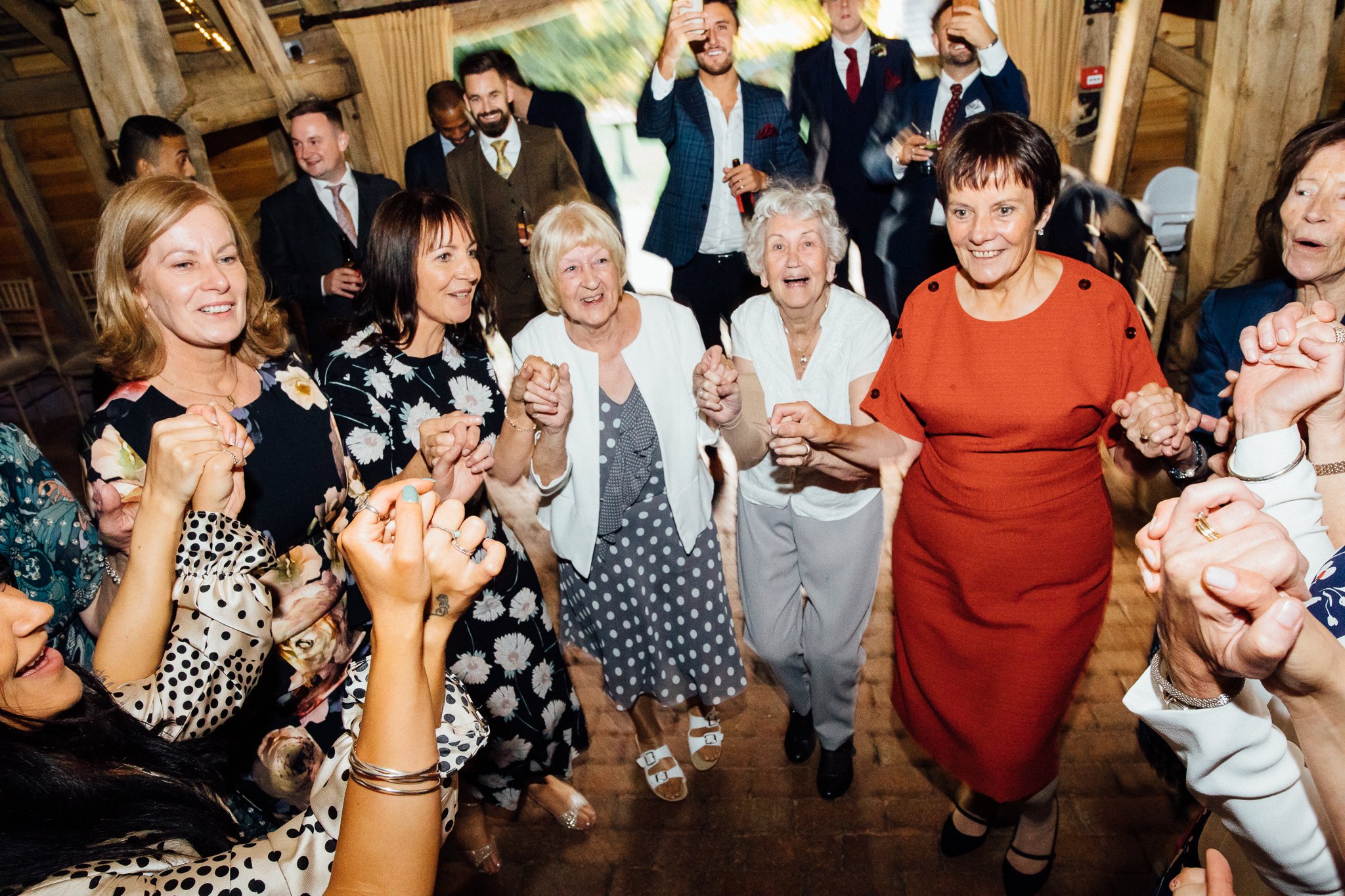  Female guests dance at Gildings Barns in Newdigate Surrey 