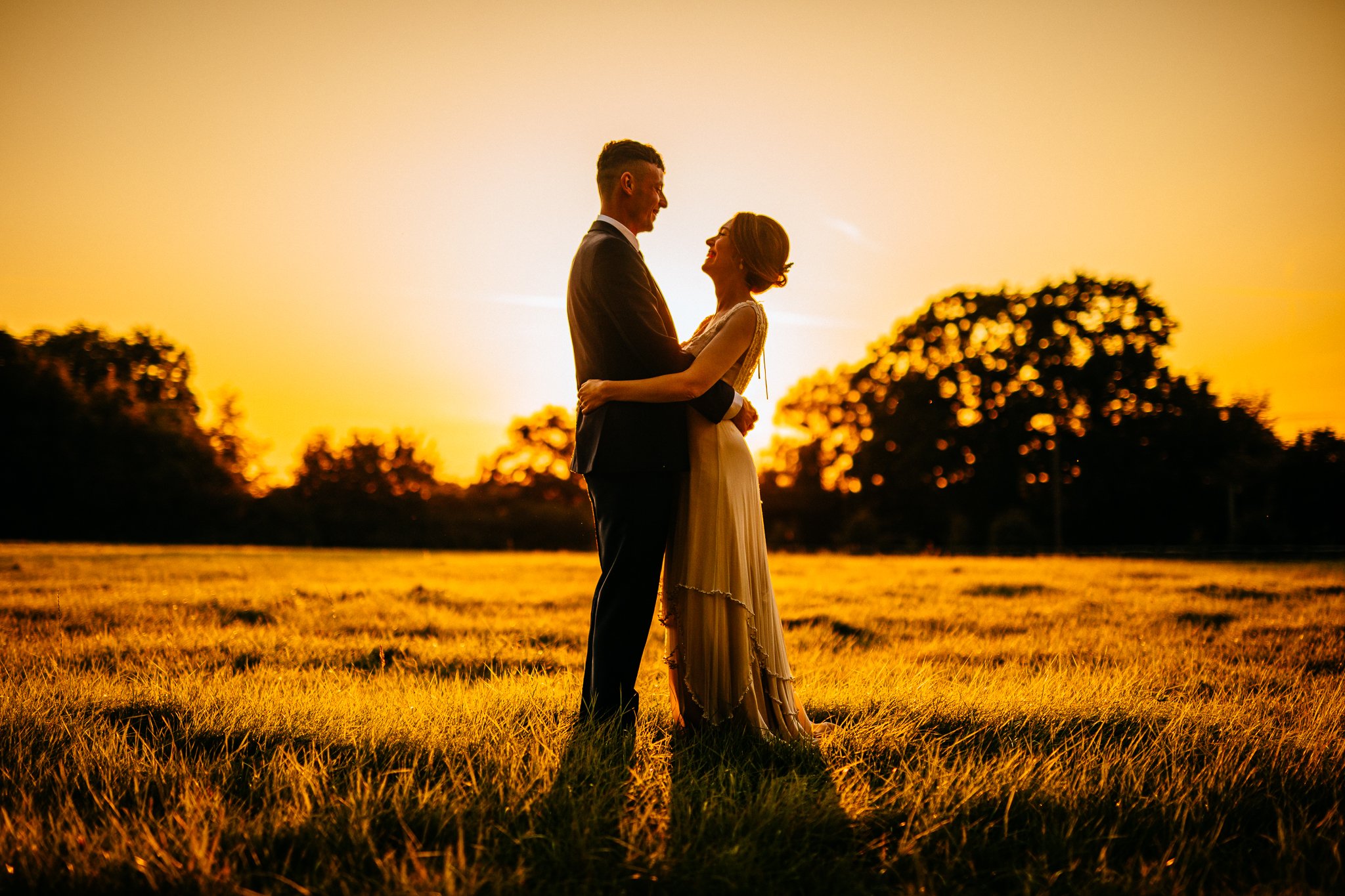  Golden hour photo of the bride and groom at Gildings Barns in Newdigate Surrey 