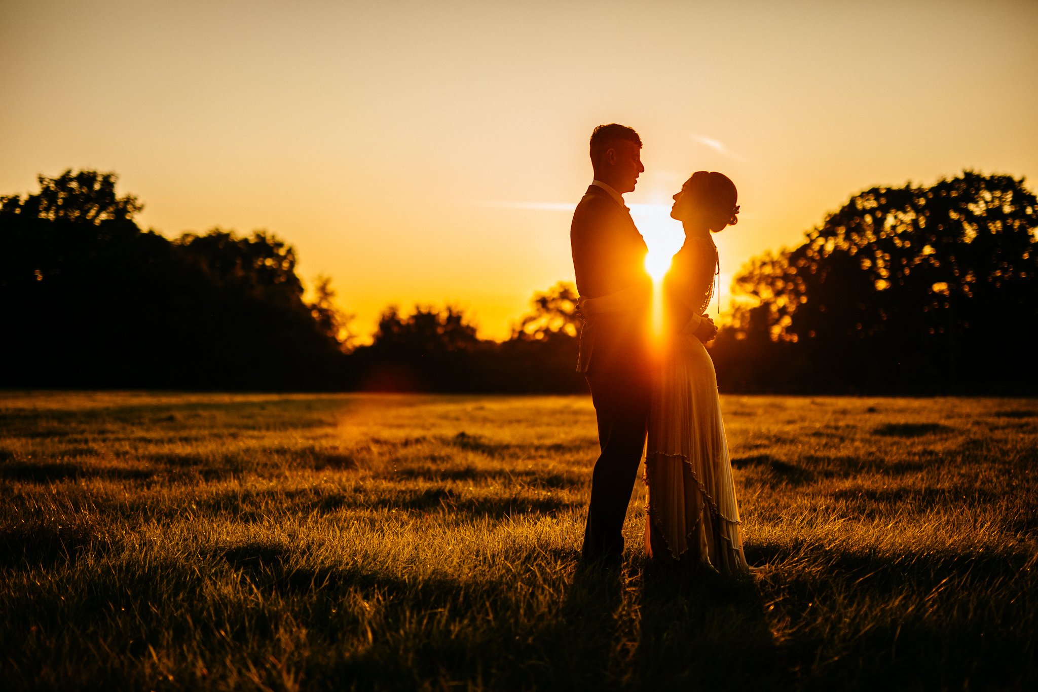  A silhouette of the Bride and Groom at Gildings Barns in Newdigate Surrey 