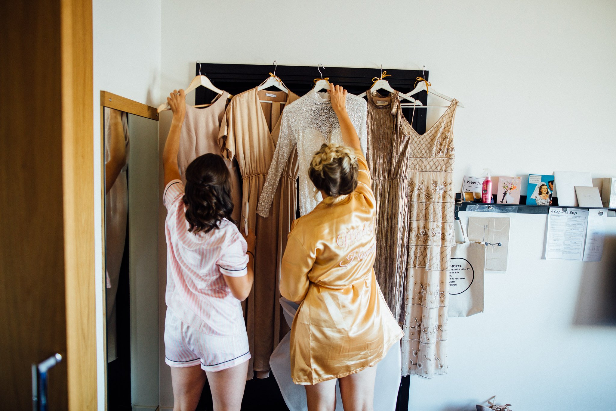  Bridesmaids hanging dresses  