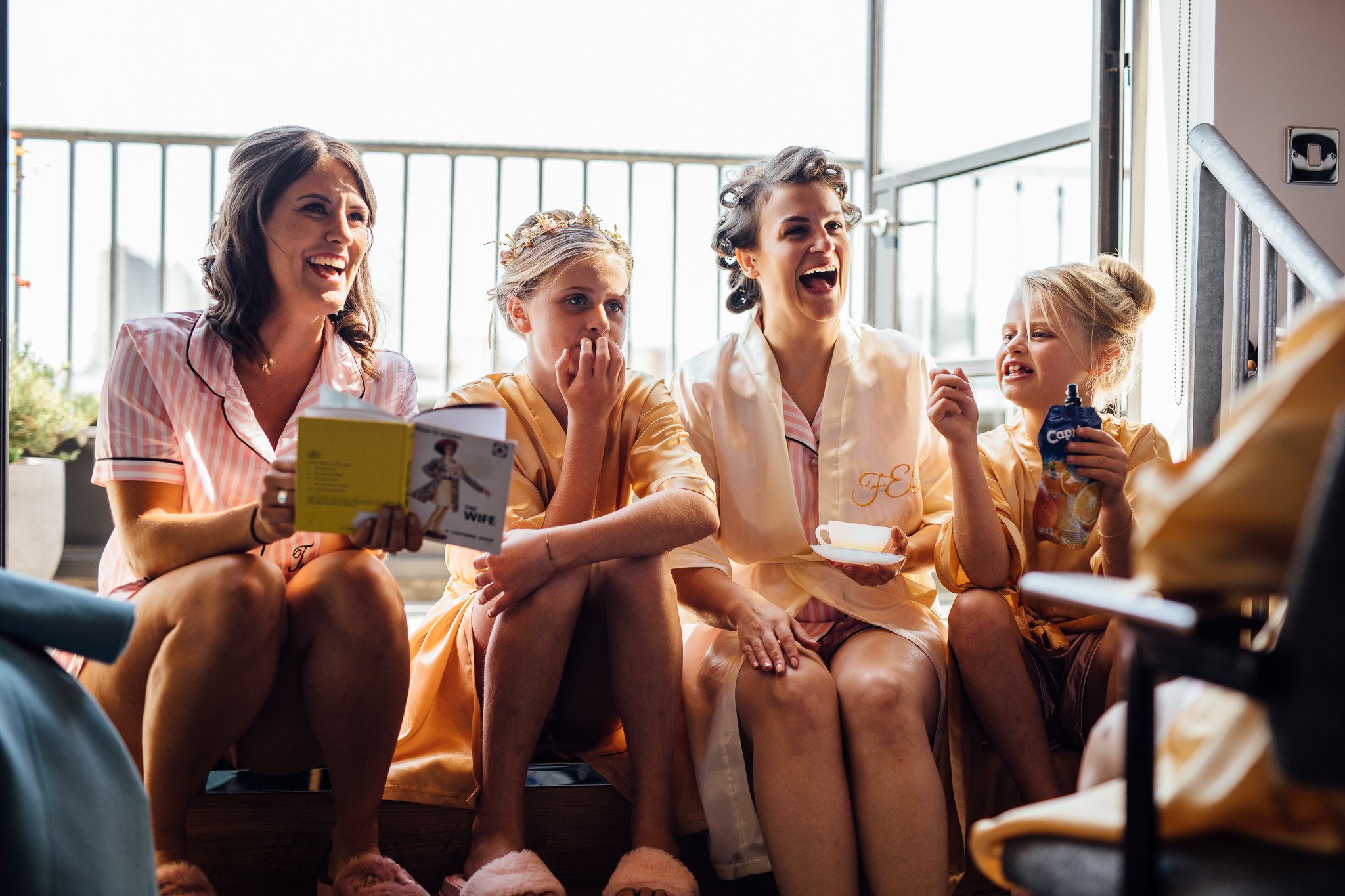  Bride and Bridesmaids laughing 