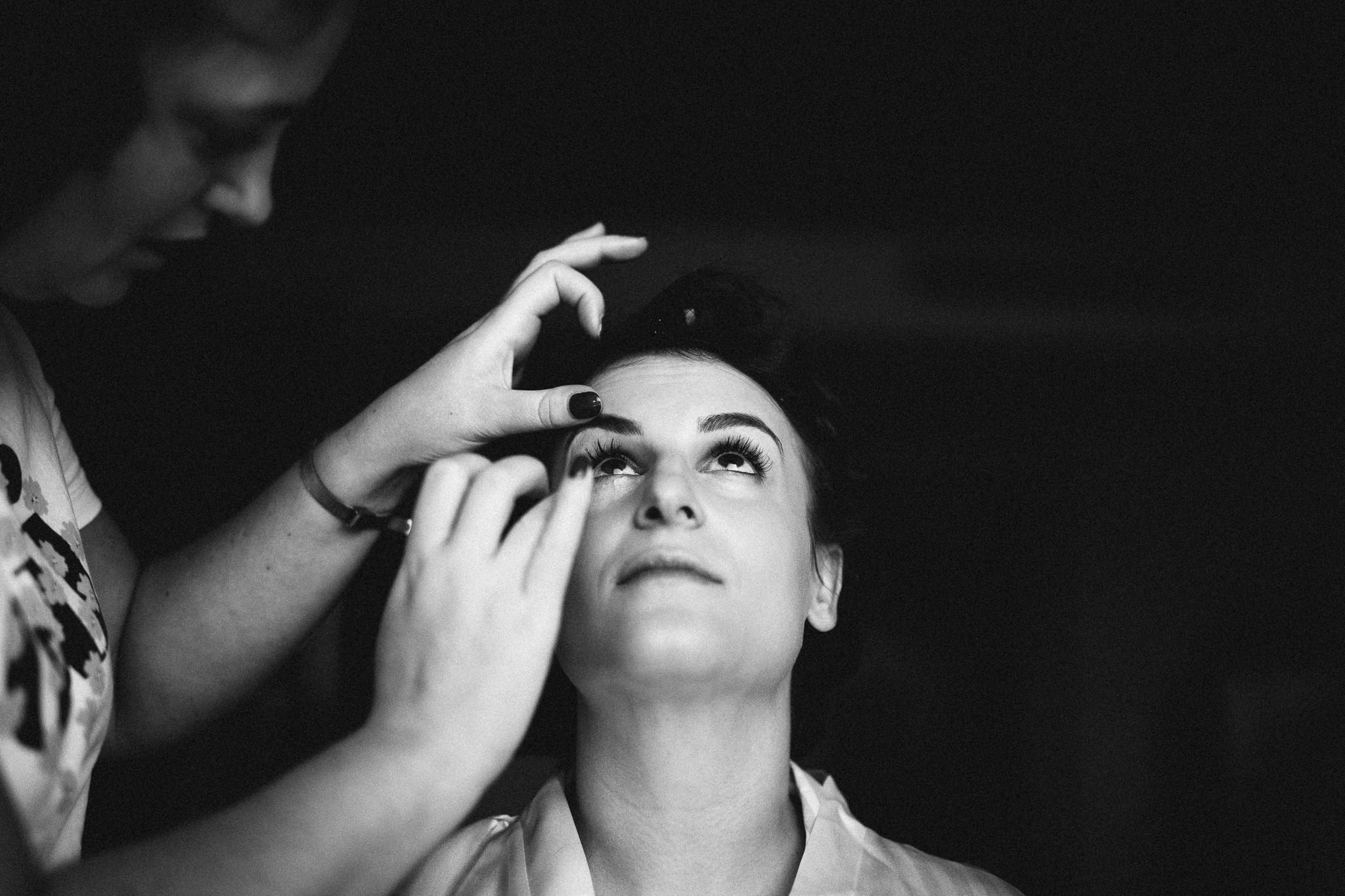  Bride having makeup applied 