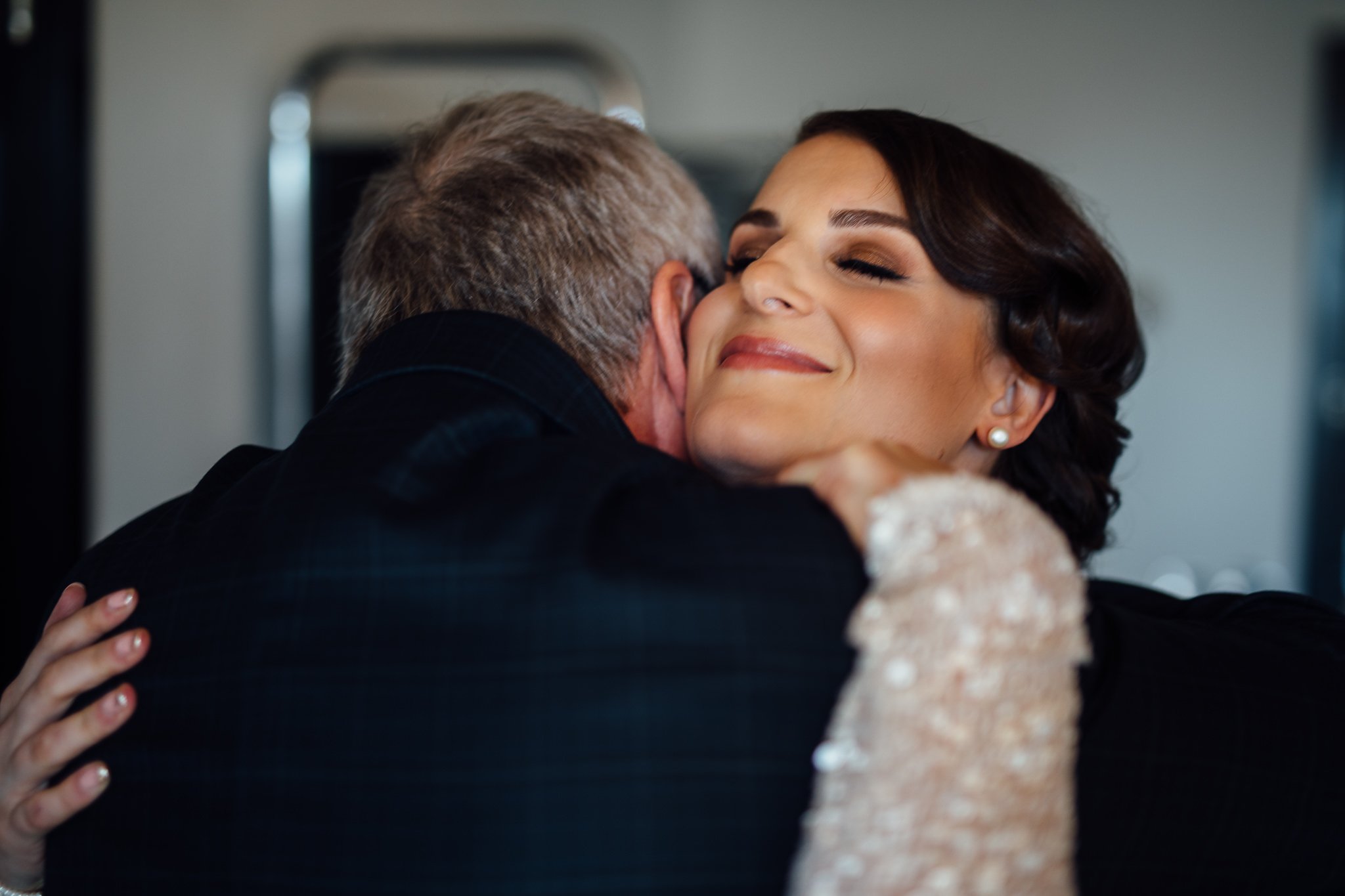  Bride hugs her father 