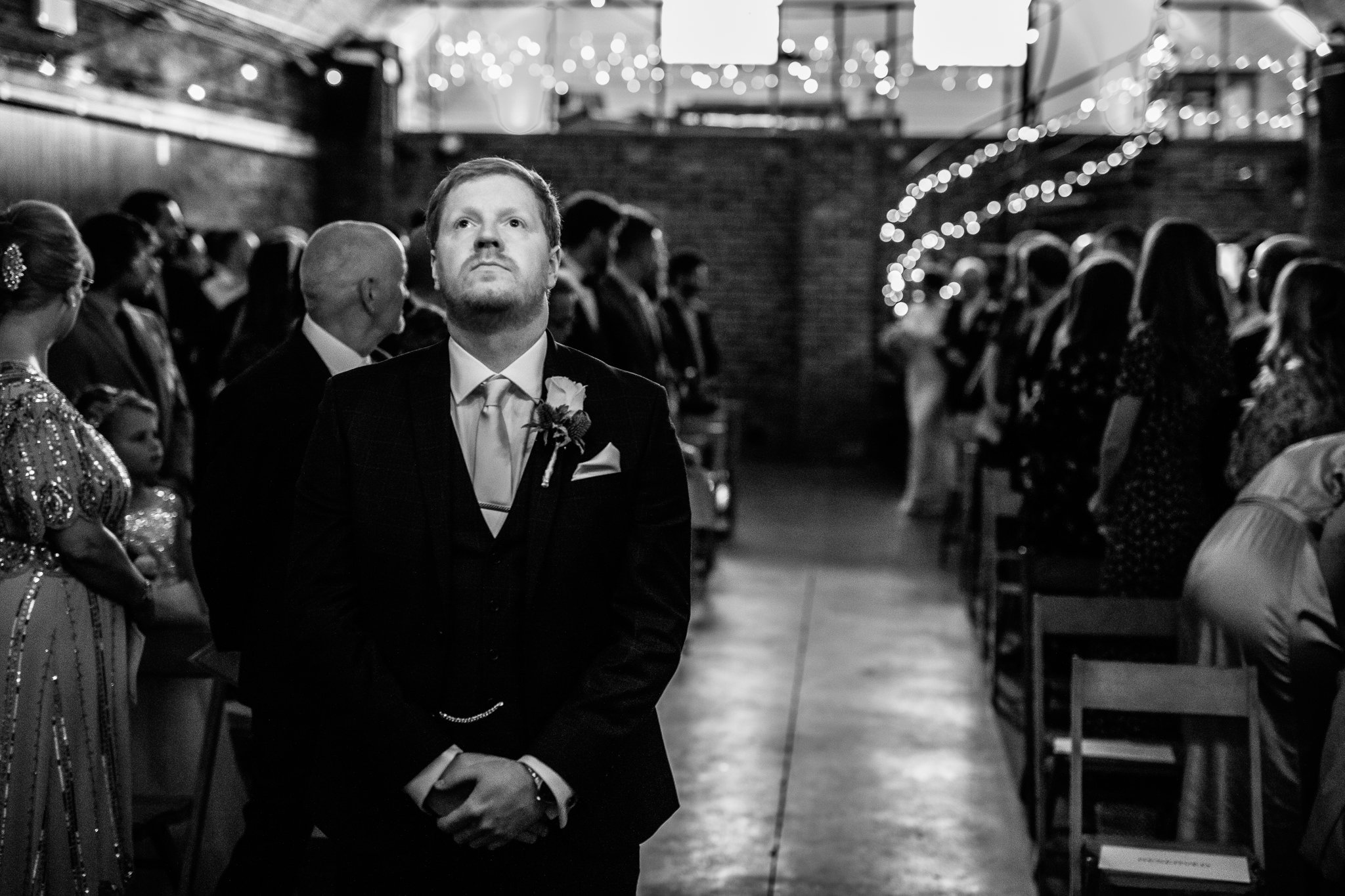  Groom looking up in anticipation at Shoreditch Studios 