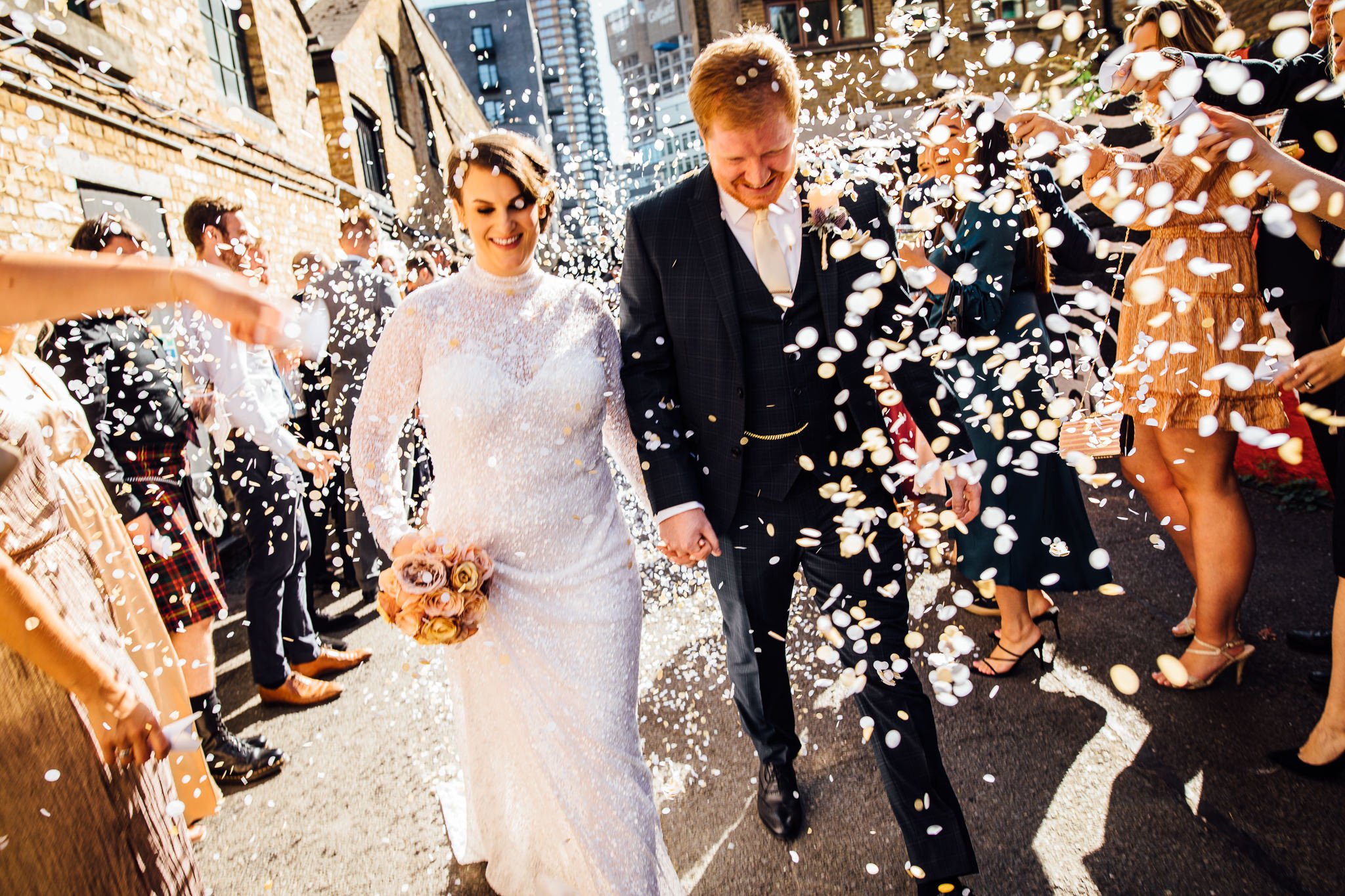  Bride and Groom have confetti thrown at them at Shoreditch Studios. 