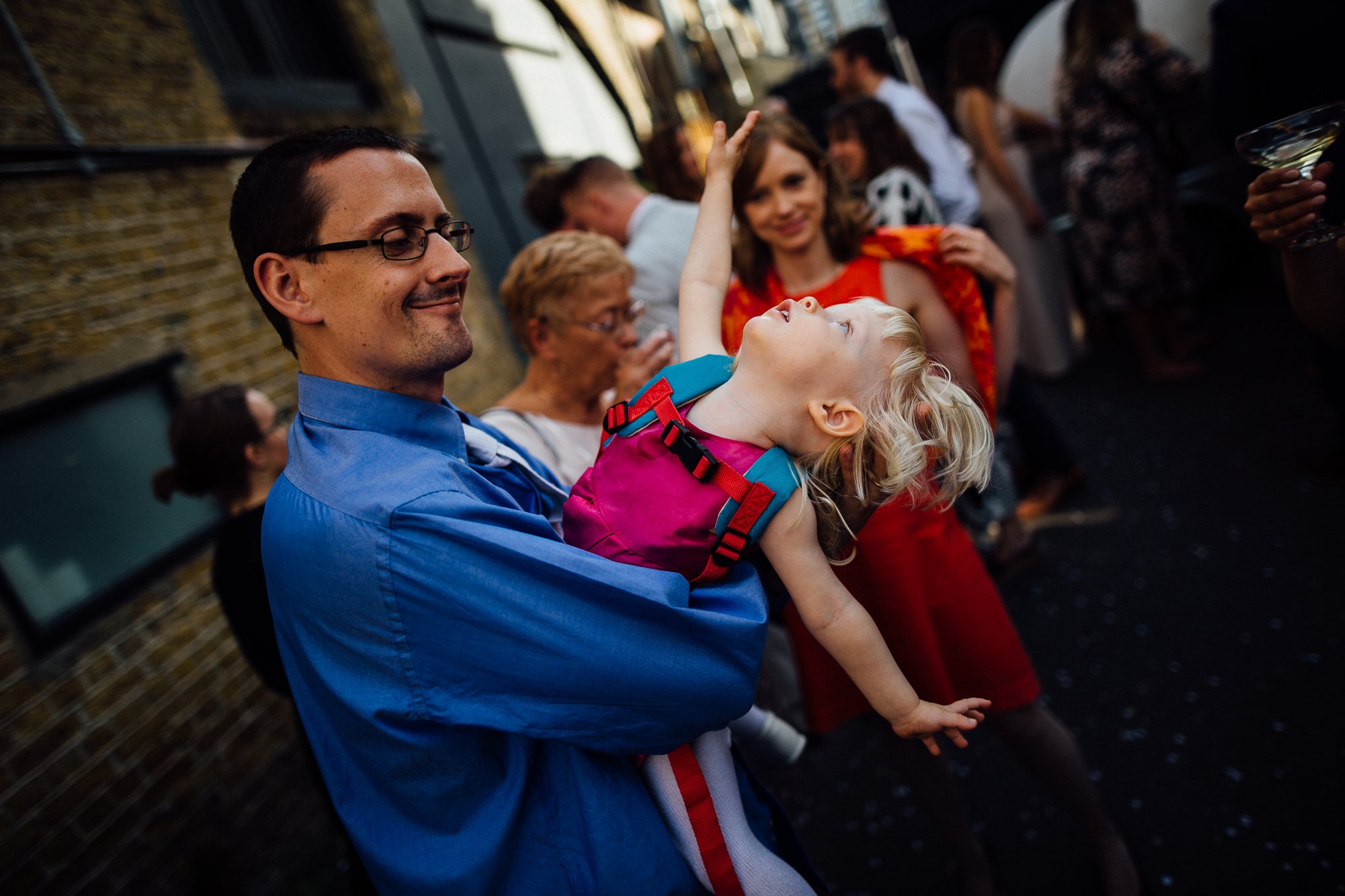  Young girl playing with her father. 