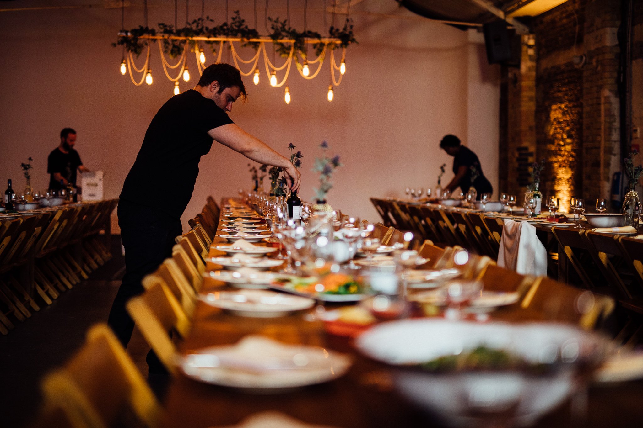  Staff at Shoreditch Studios preparing the tables for guests. 