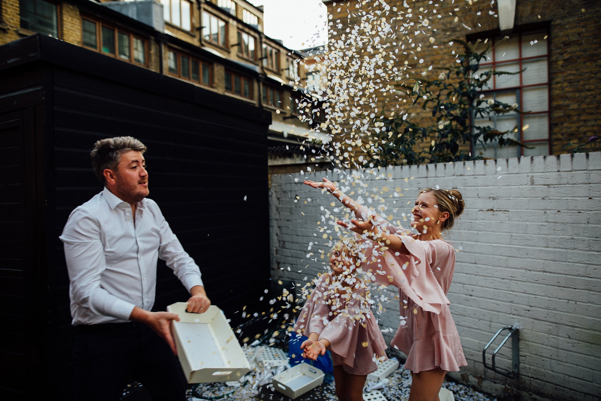  Girls play with confetti. 