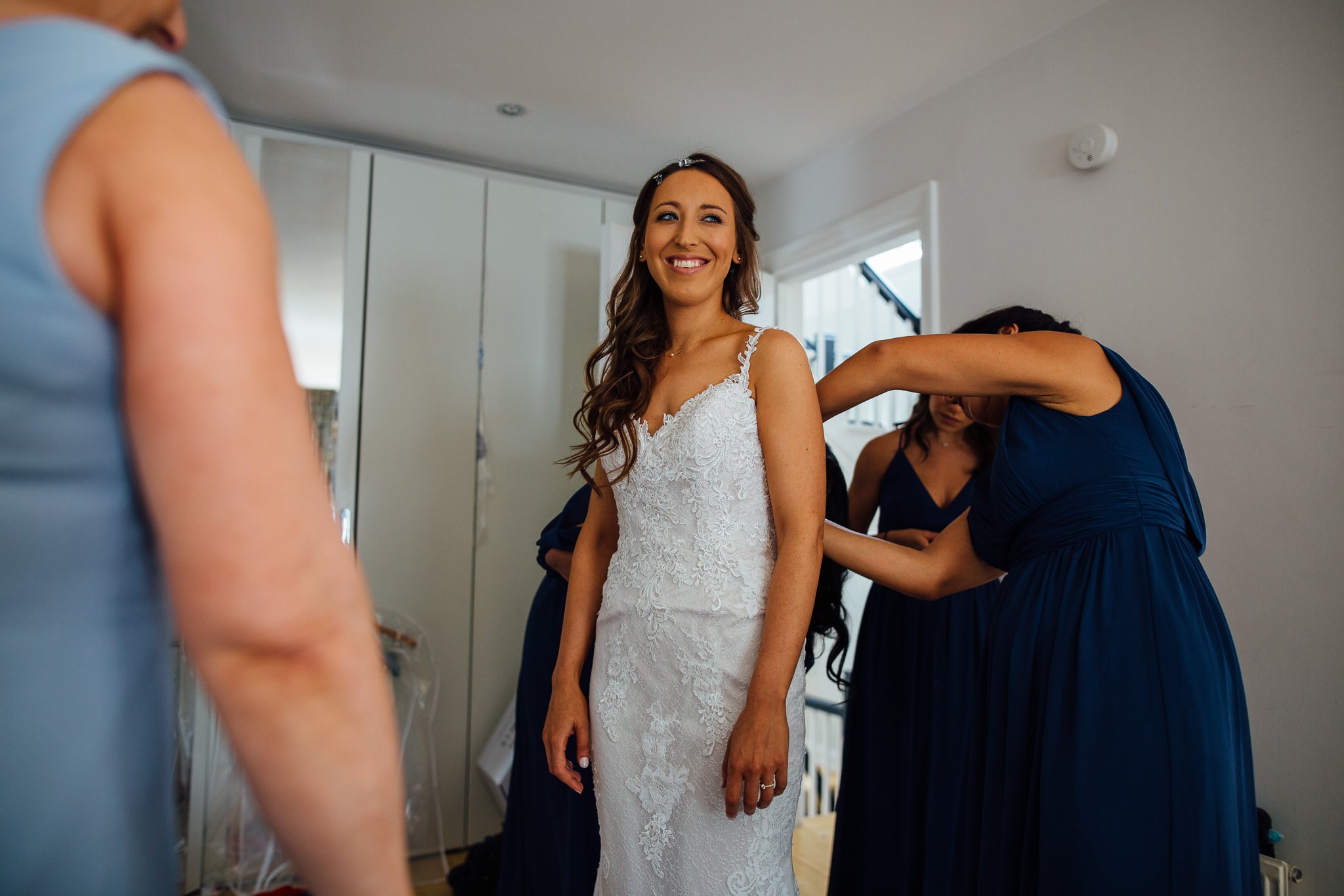  Bride smiling with her dress on 