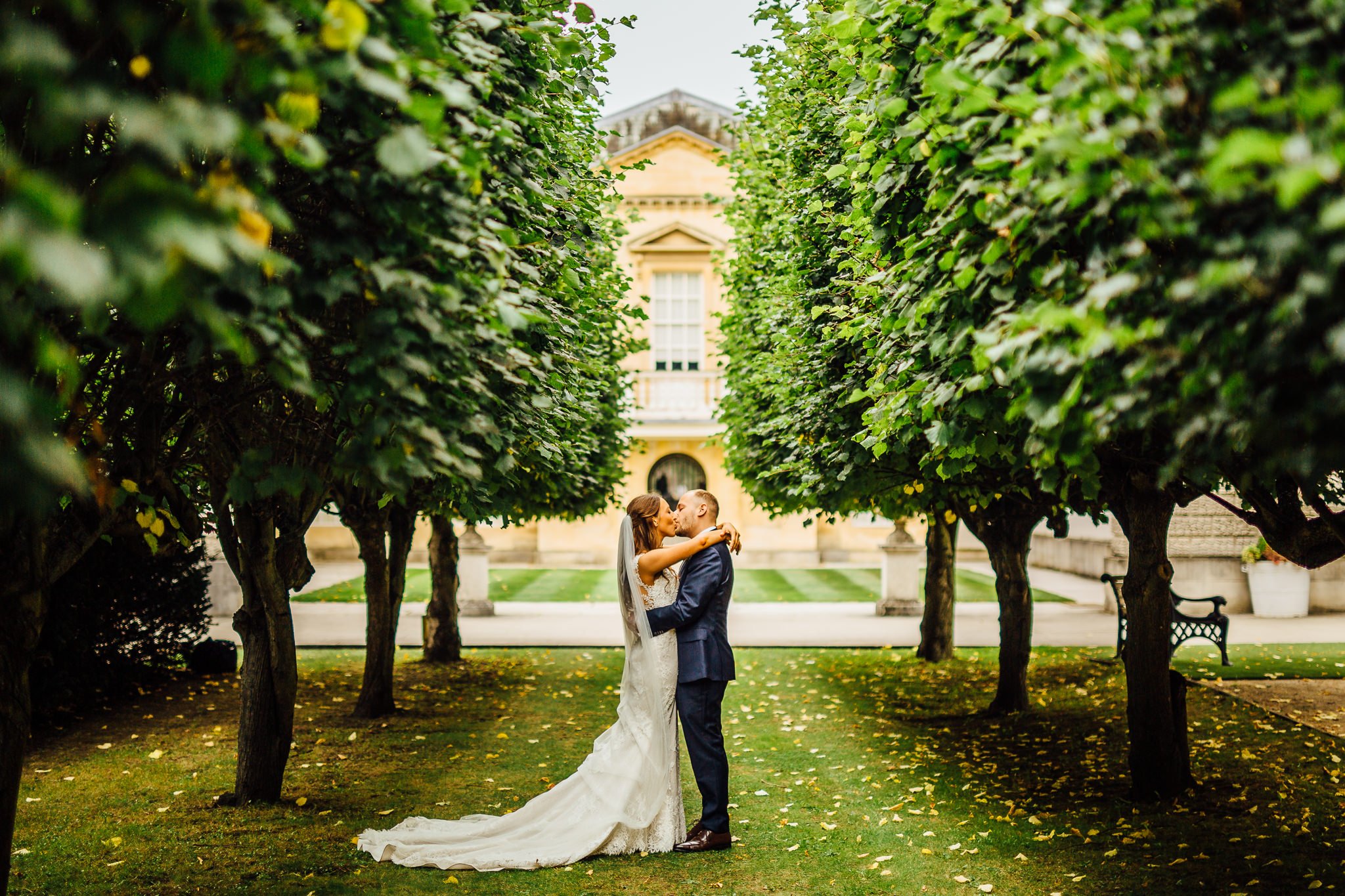  Bride and Groom kiss in the grounds of Chiswick House and Gardens 
