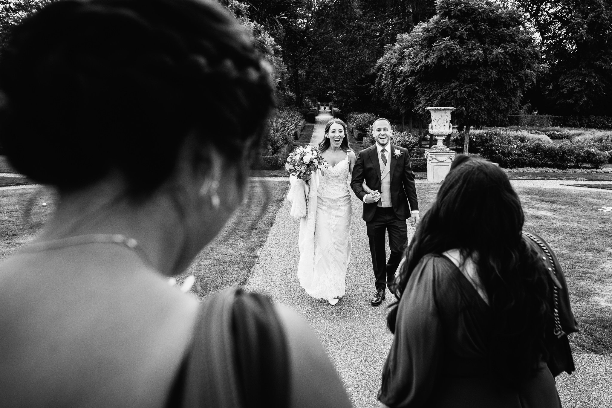  Bride and Groom look elated to see their friends 