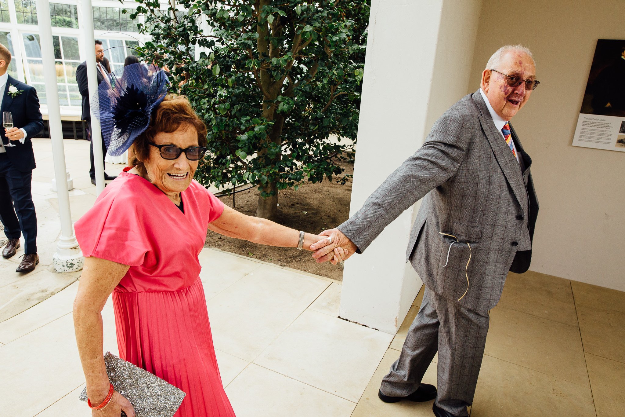  Elderly couple walking hand in hand 