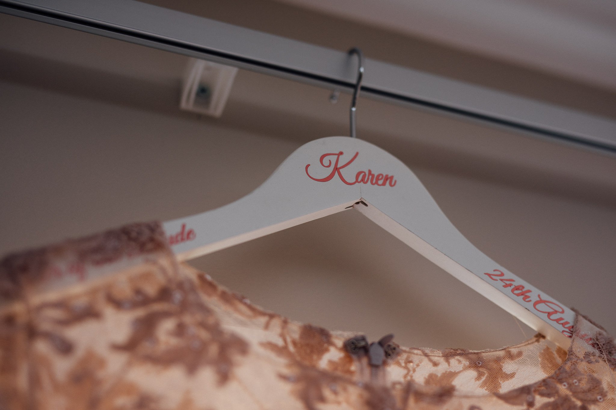  Clothes hanger showing the name of the wearer of the dress 