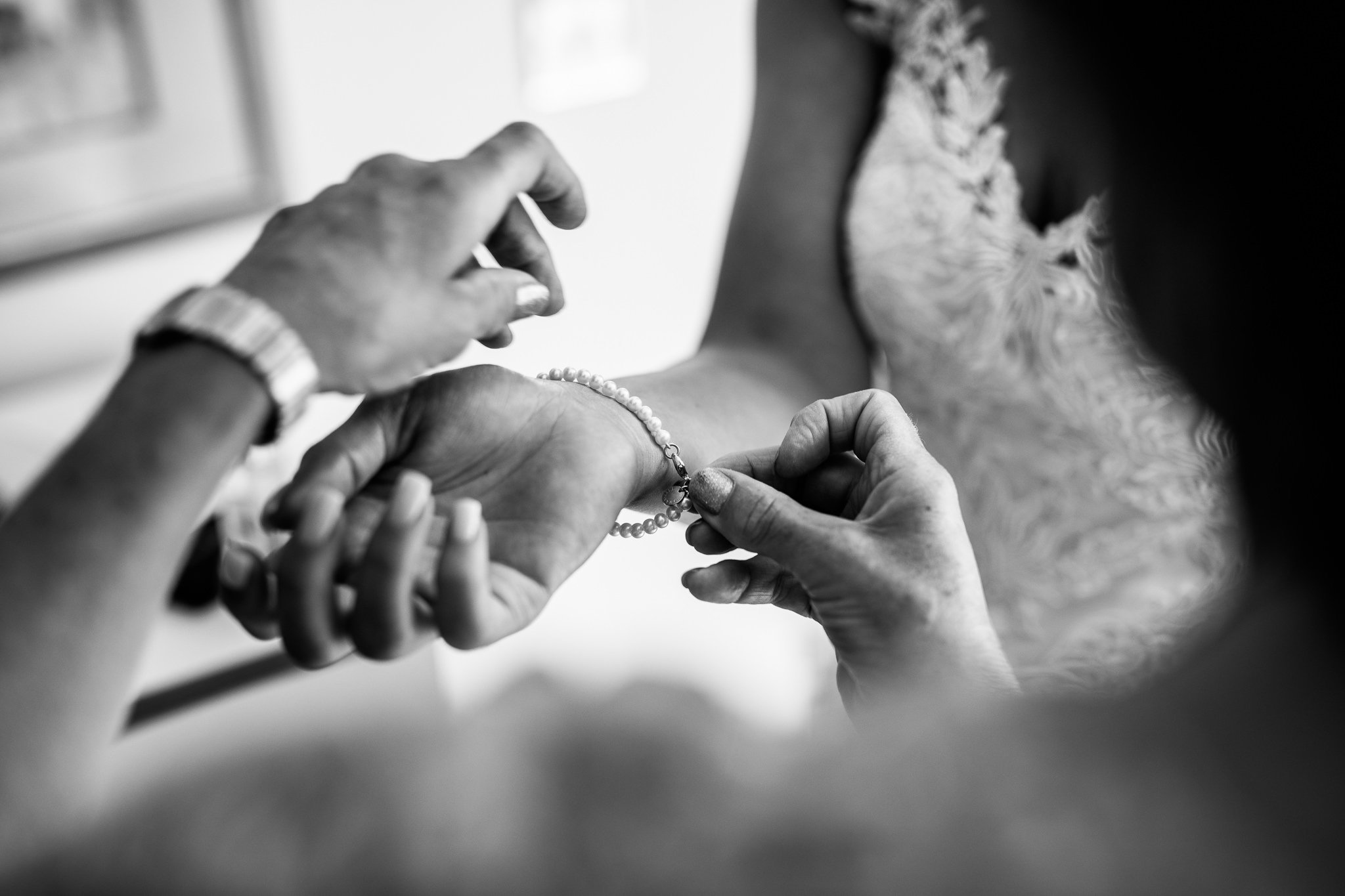  Bride’s bracelet being put on. 
