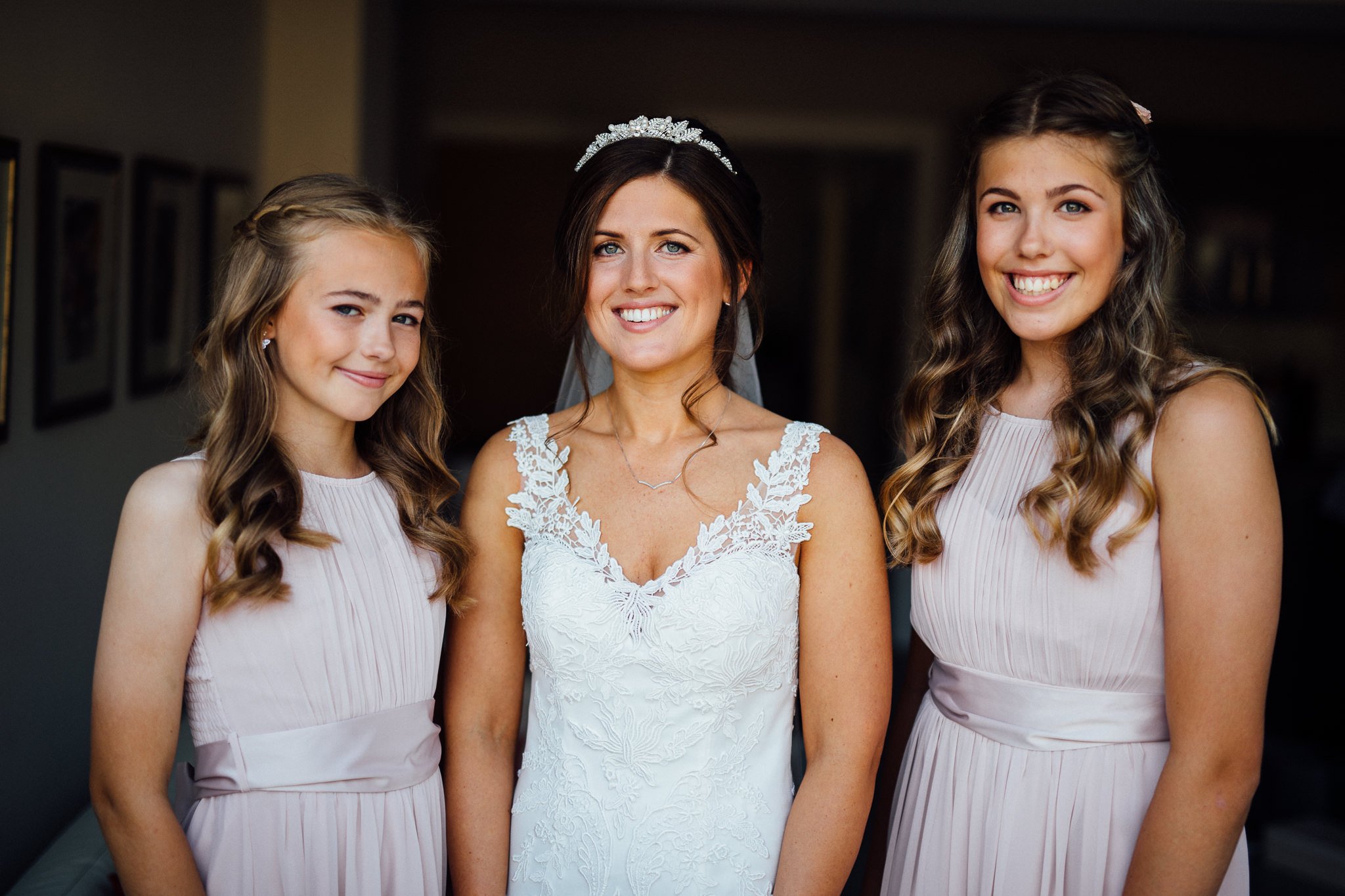  Bride and Bridesmaid pose for a photo 