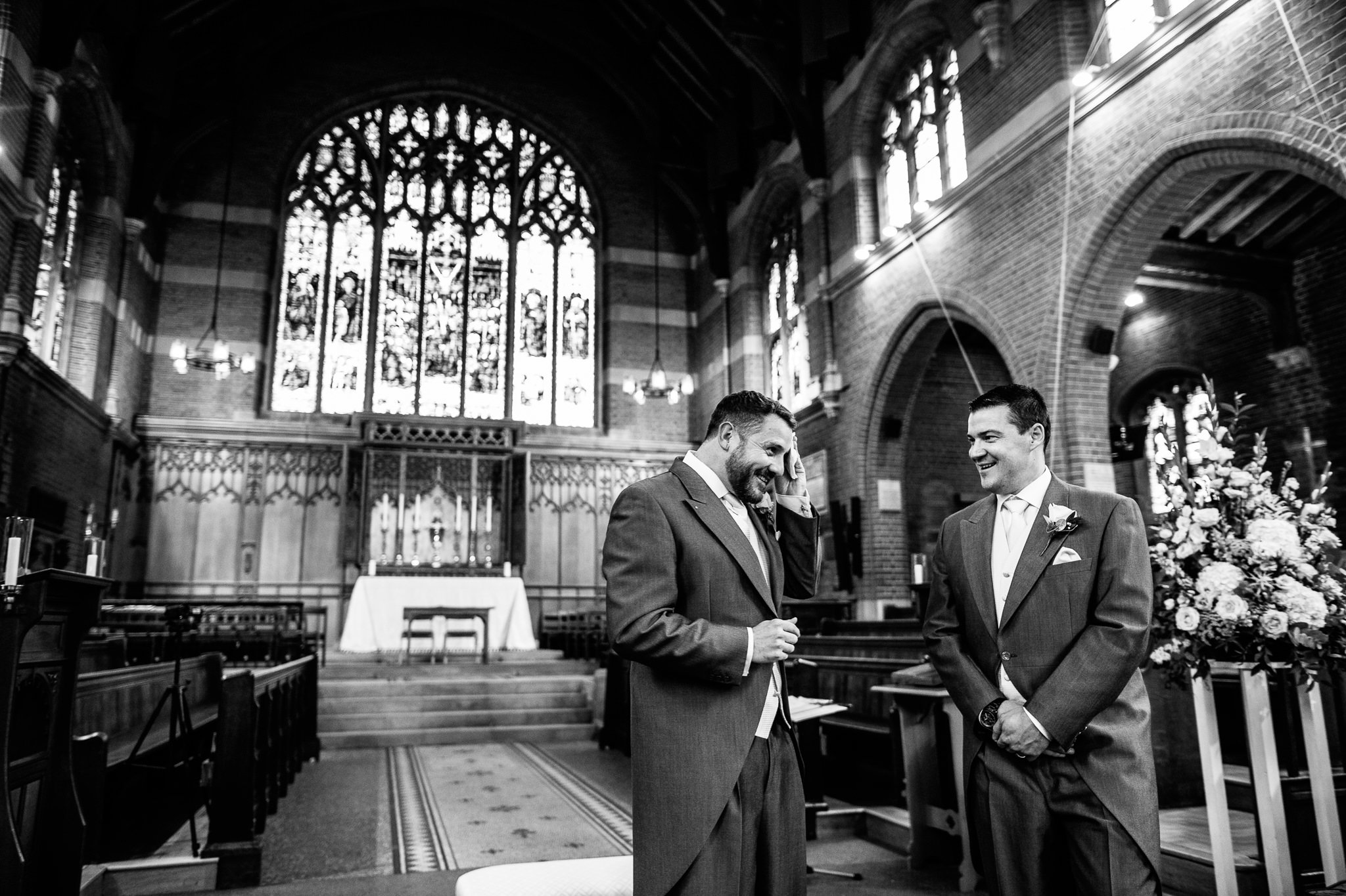  Groom wipes away sweat at the Chapel of St Luke at Epsom College 