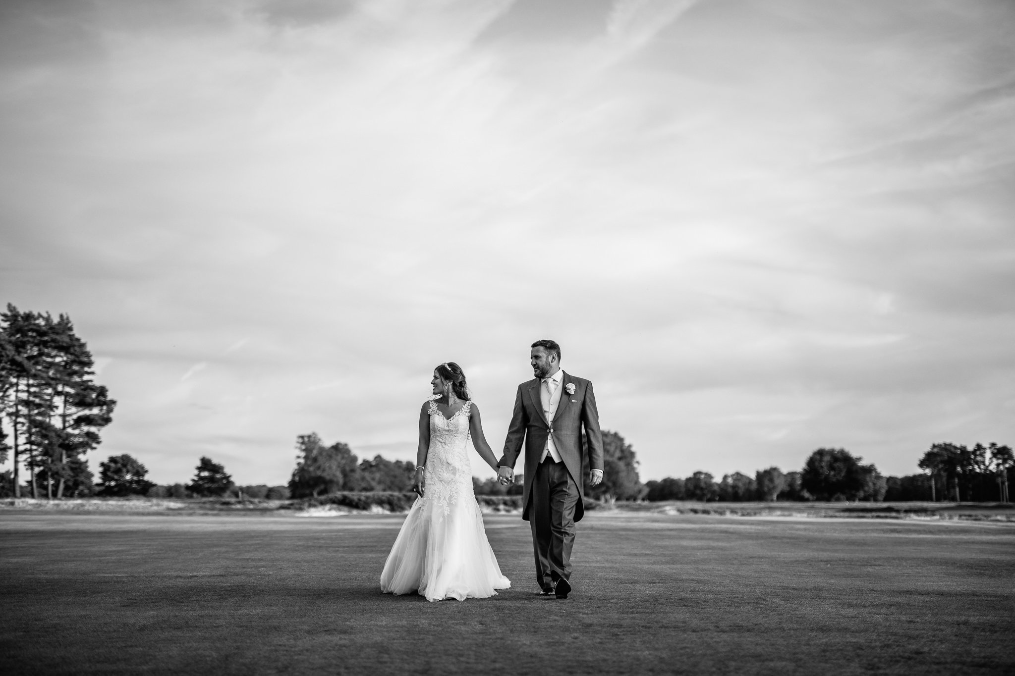  Bride and Groom on their wedding day  at Walton Heath Golf Club Surrey 