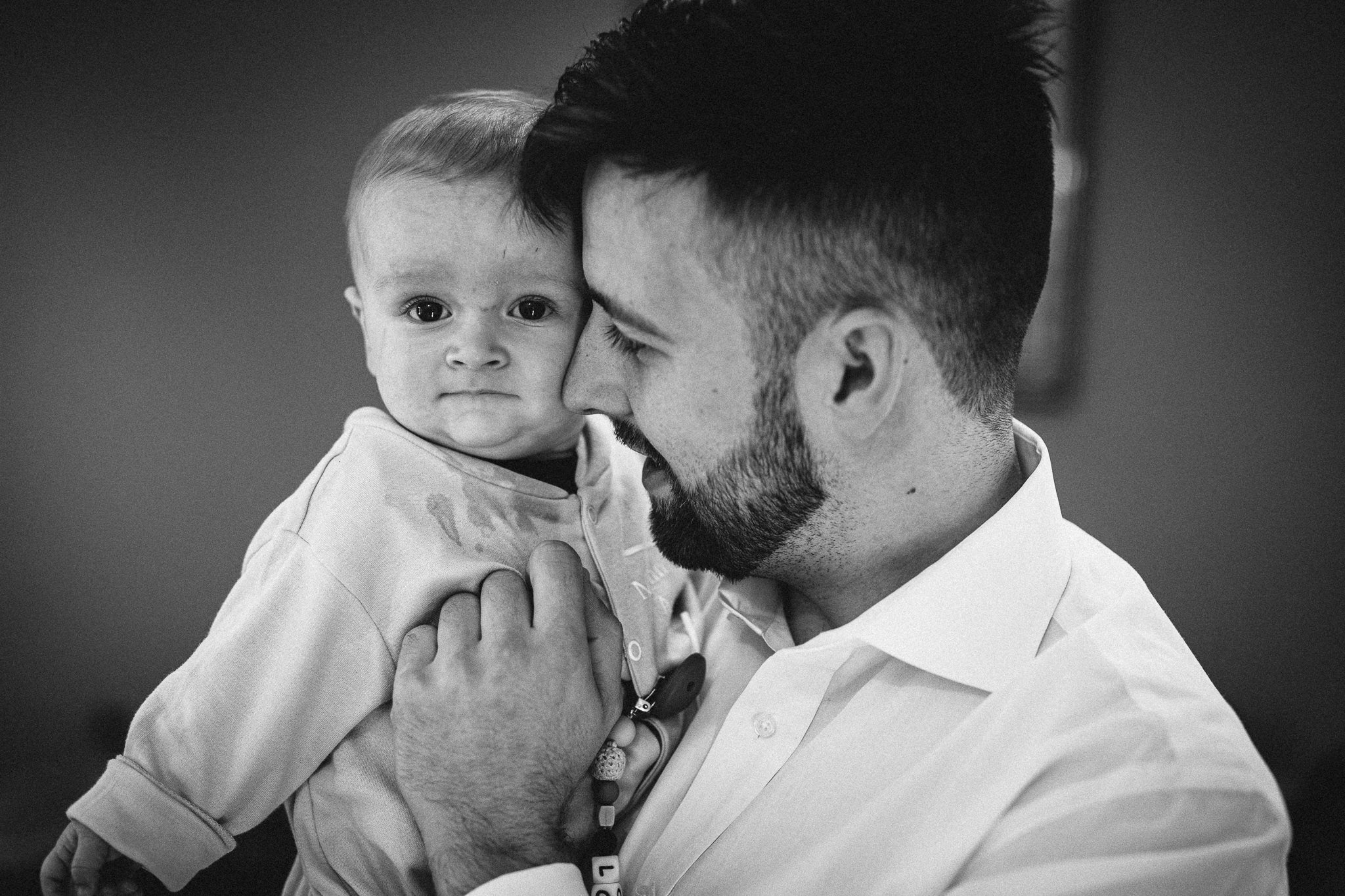  Groom holds his son. 