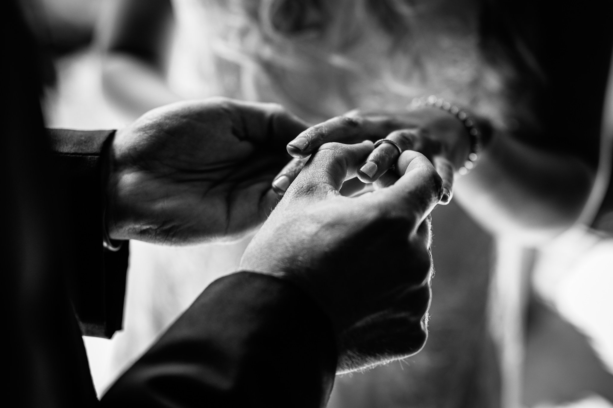  Groom places ring on Bride’s finger at Winters Barns Wedding Venue Kent 