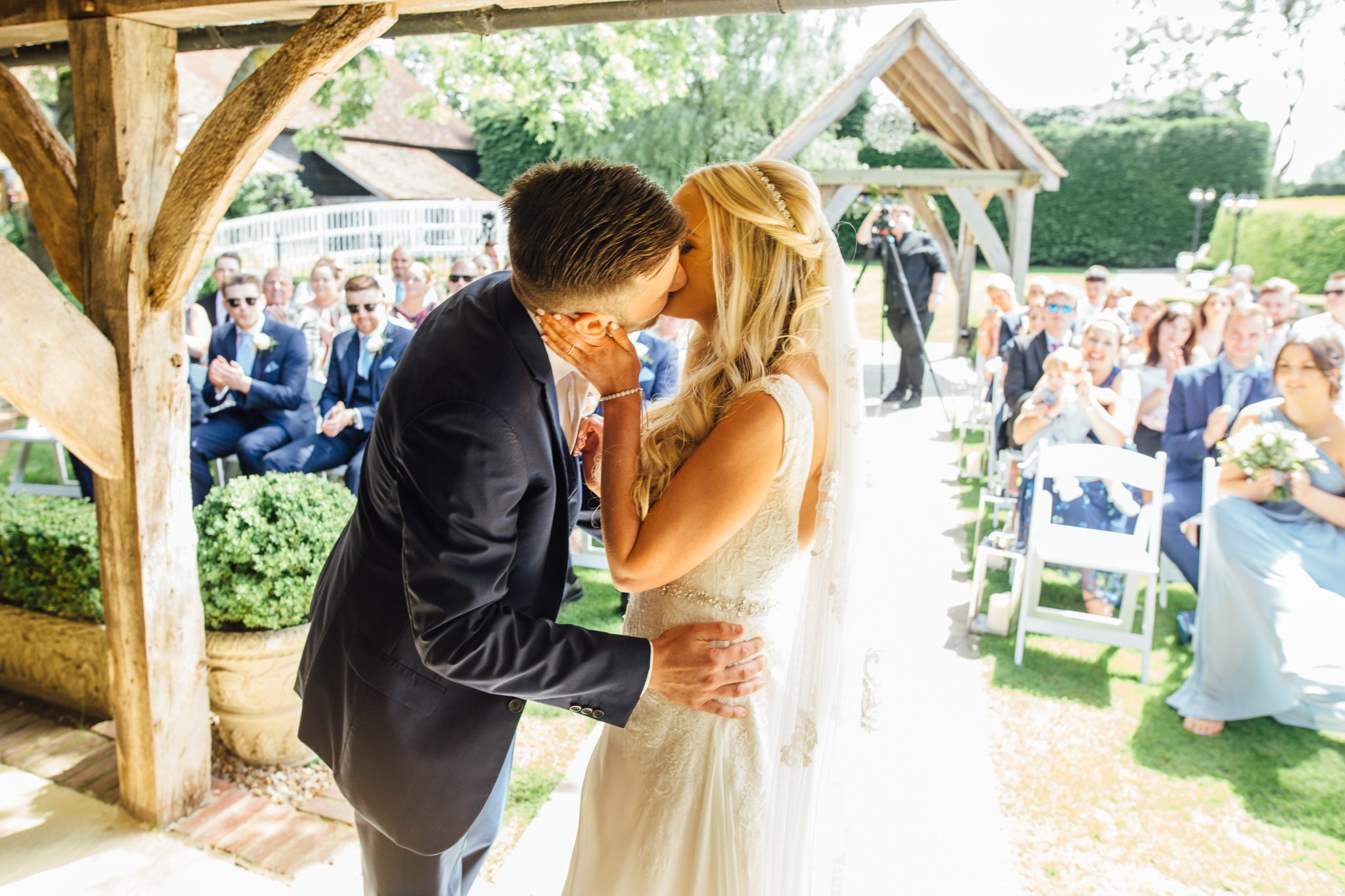  Groom kisses Bride at Winters Barns Wedding Venue Kent 