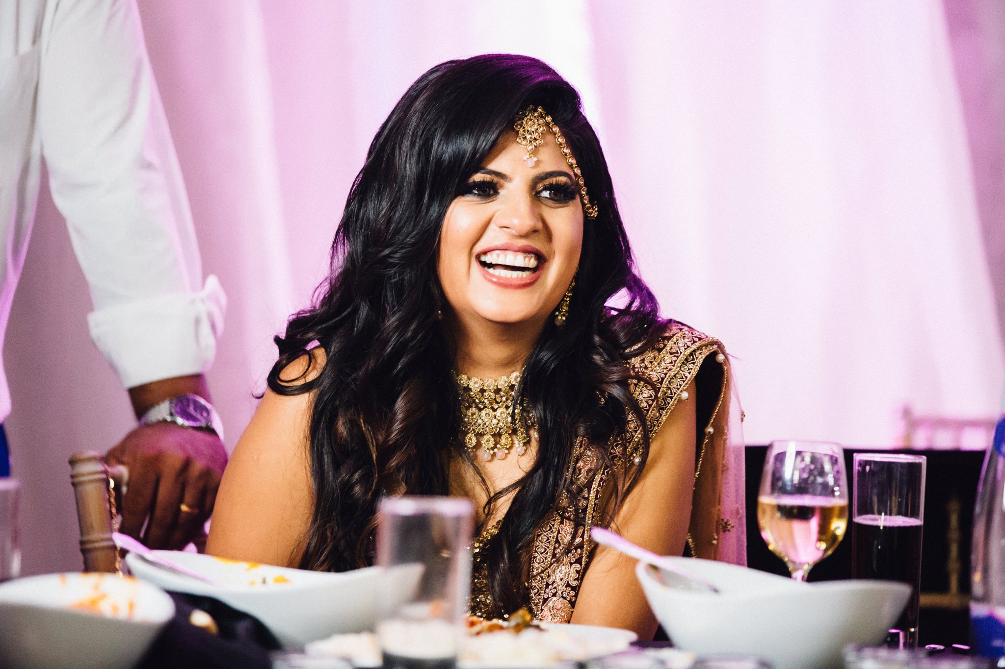  Bride laughing during speech 