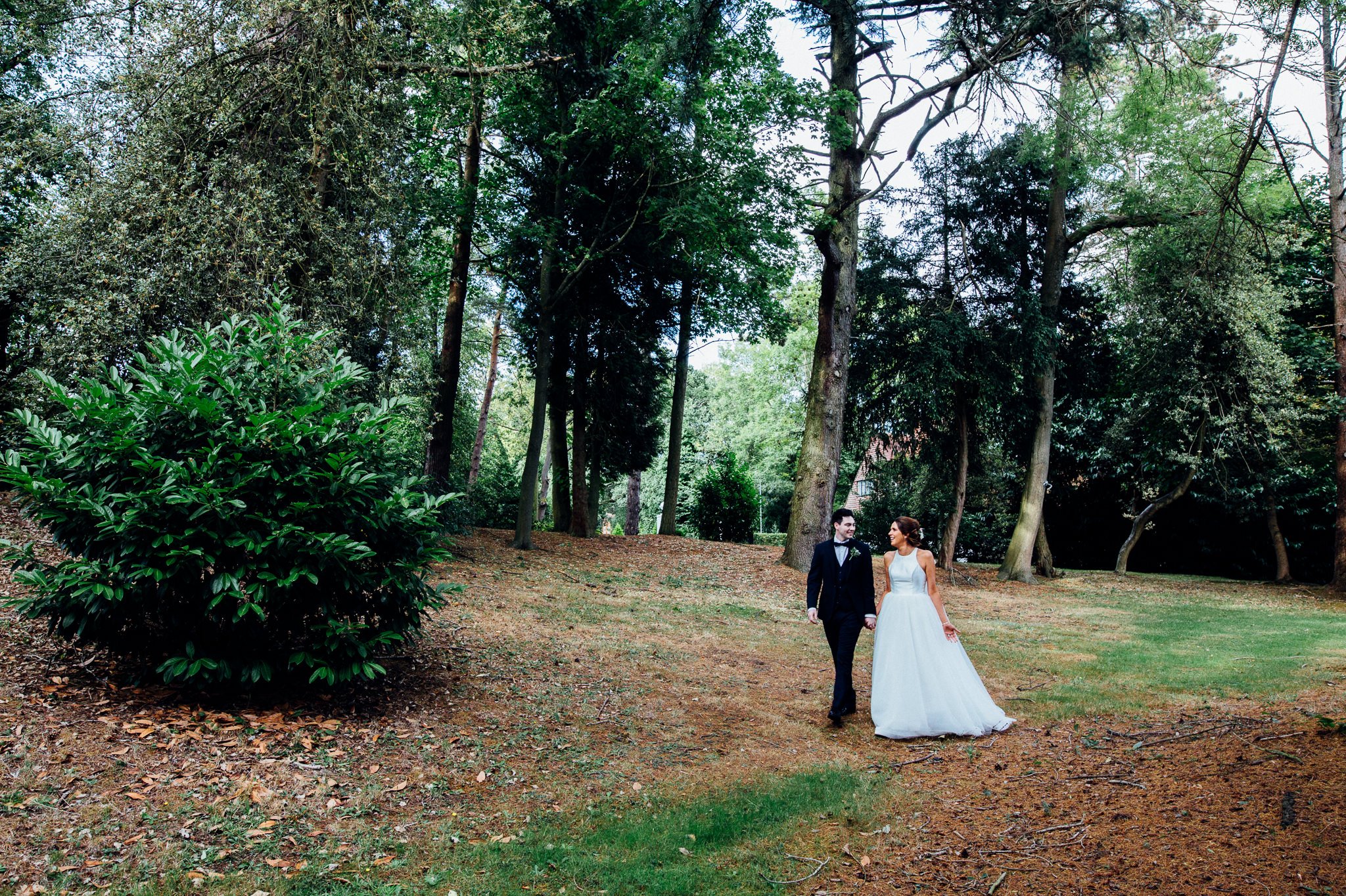  Bride and Groom take a walk outside Laura Ashley The Manor Elstree 