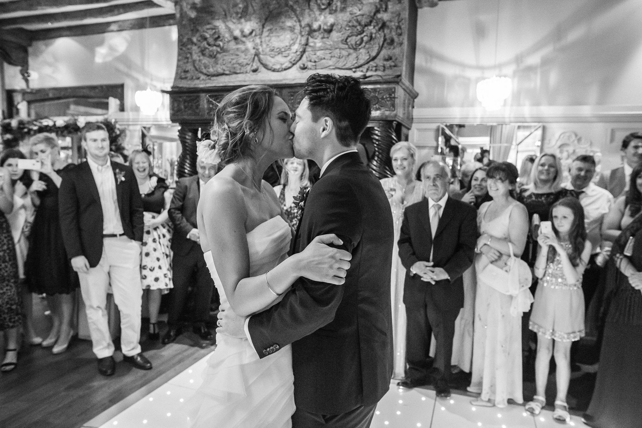  Bride and Groom kiss during first dance 