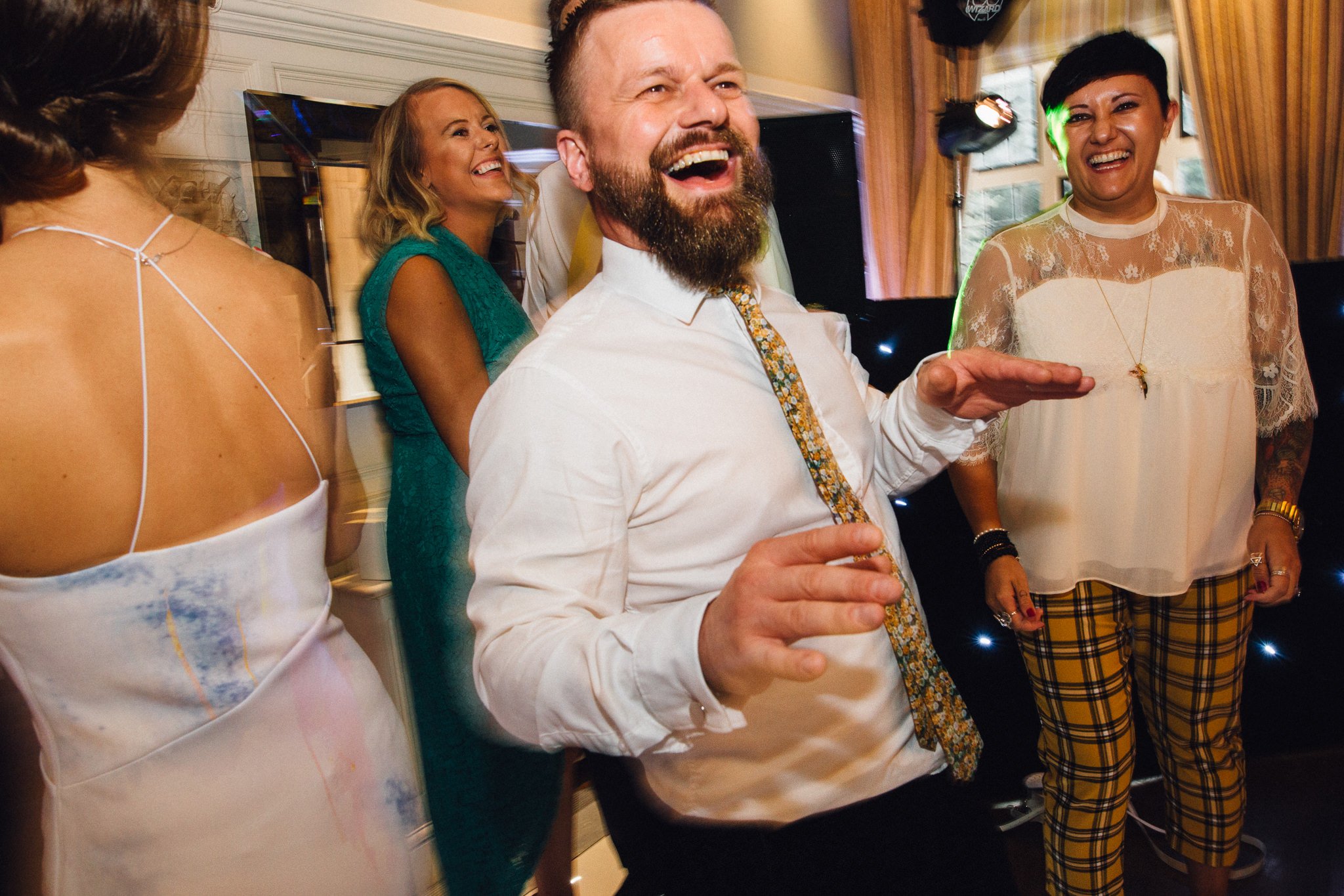  Wedding guest smiling on the dancefloor 