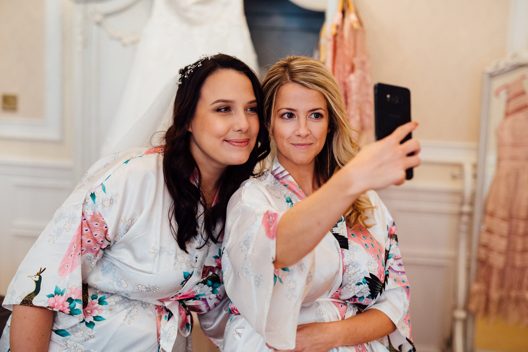  Bride and Bridesmaid taking a selfie 