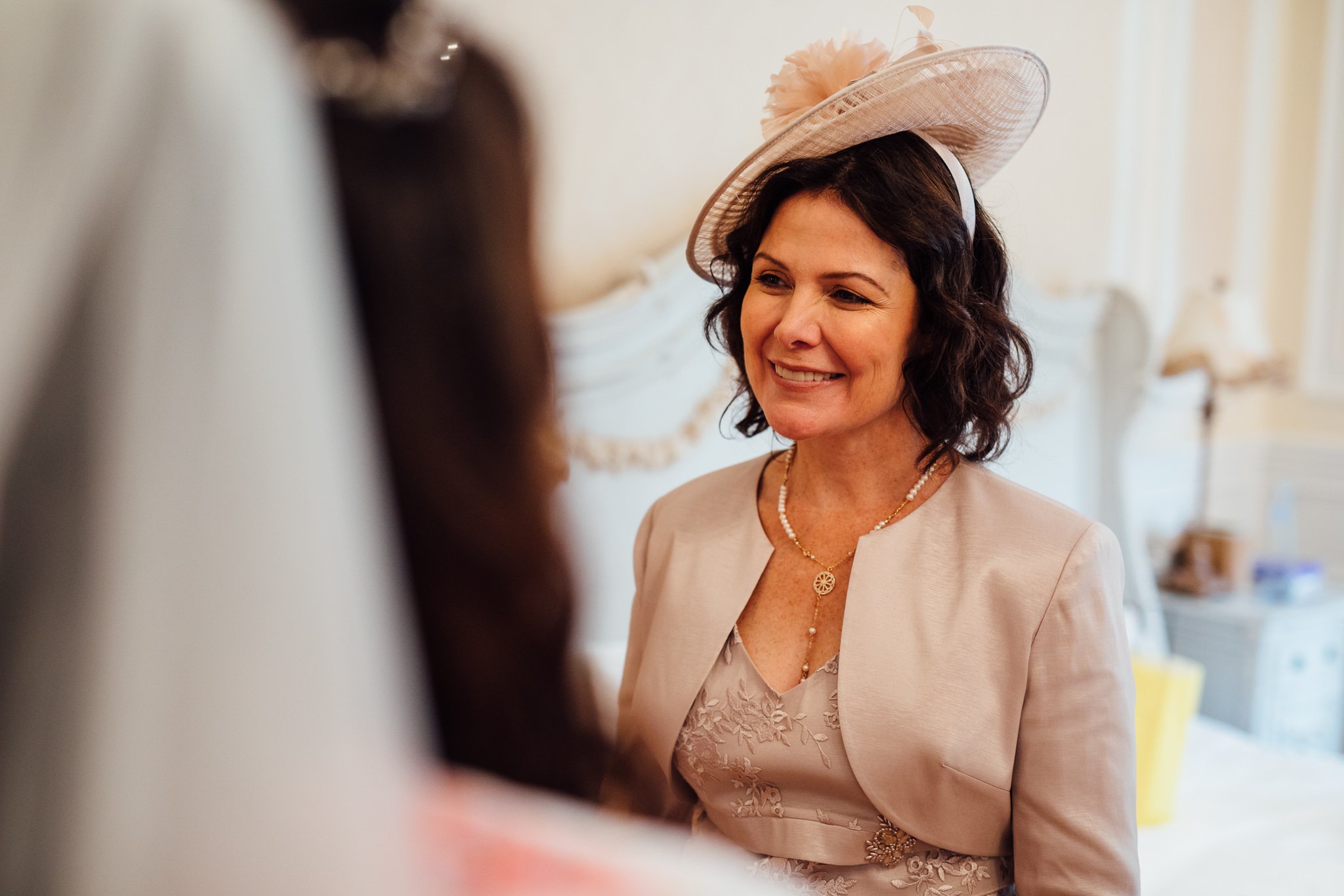  Mother of the bride wearing a fascinator at Warren House Hotel Kingston upon Thames 