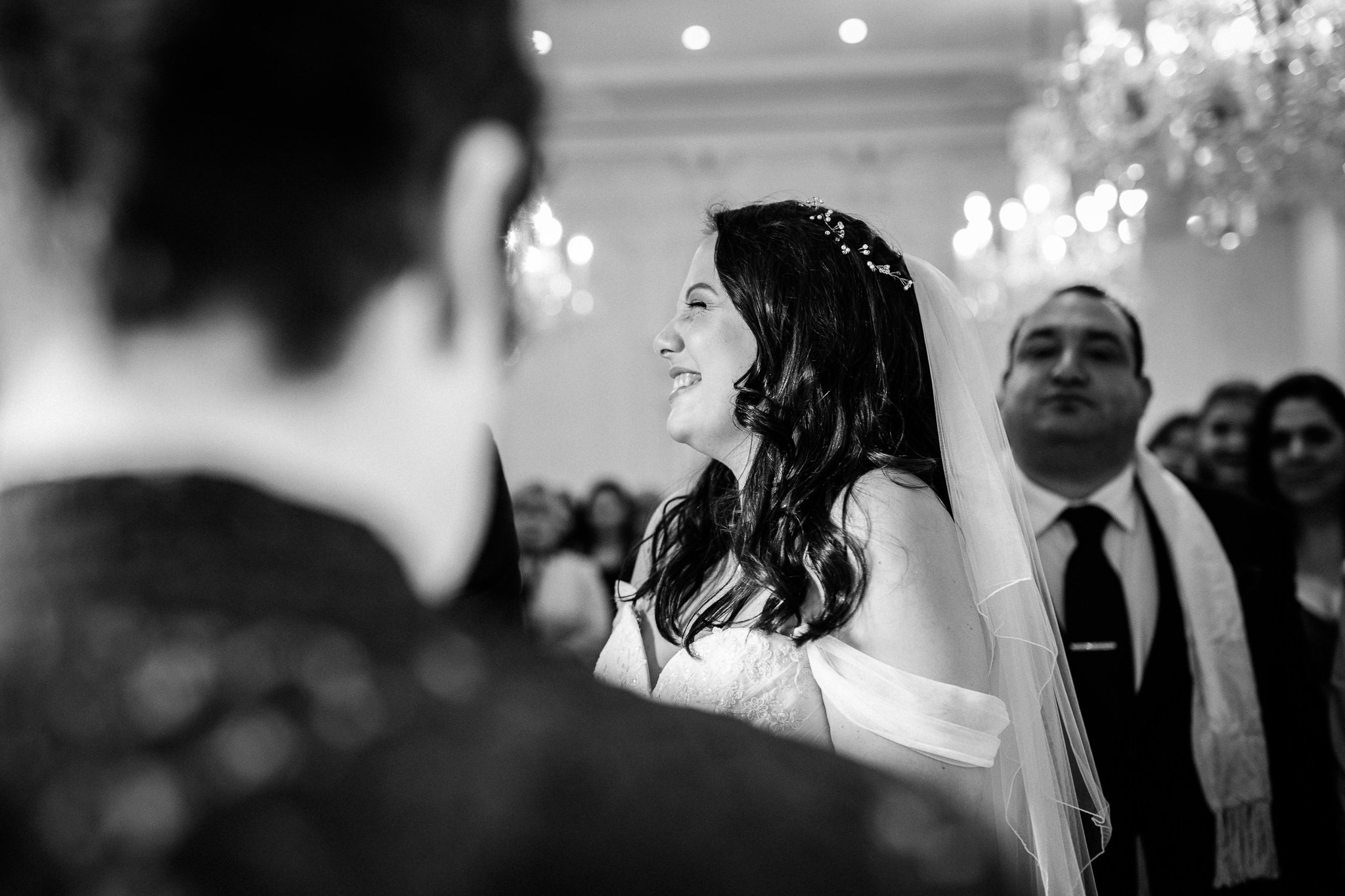  Bride smiling at the top of the aisle 
