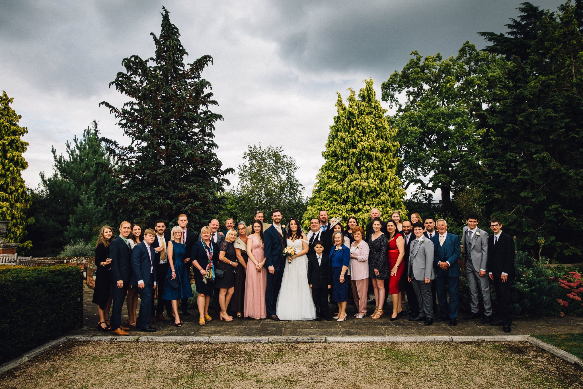  Large group shot of wedding guests at Warren House Hotel Kingston upon Thames 