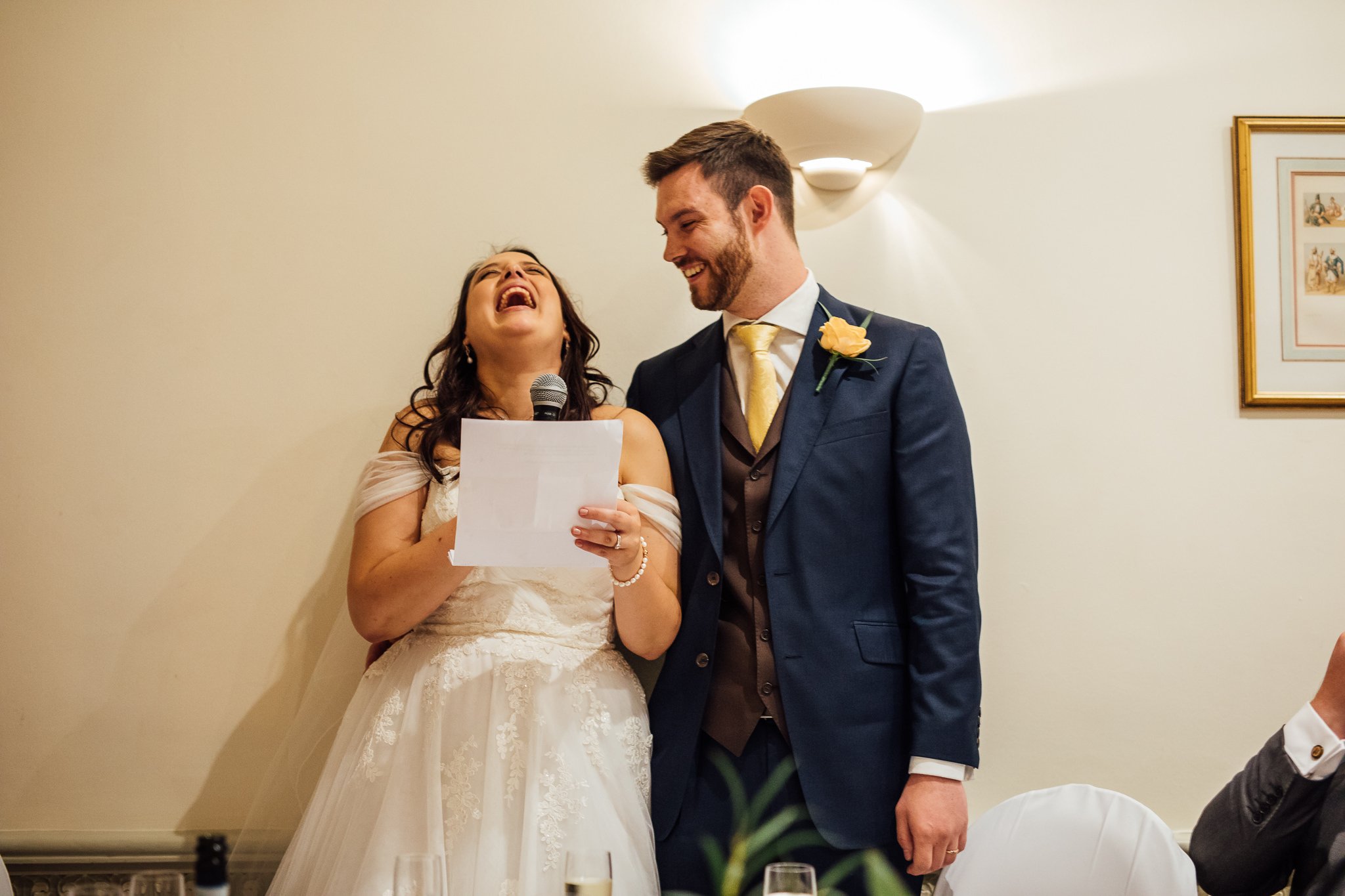  Bride laughing whilst she gives a speech 