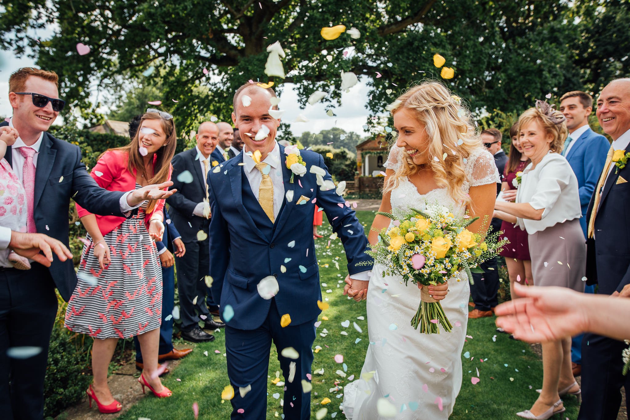  Bride and Groom have confetti thrown at them at Micklefield Hall 