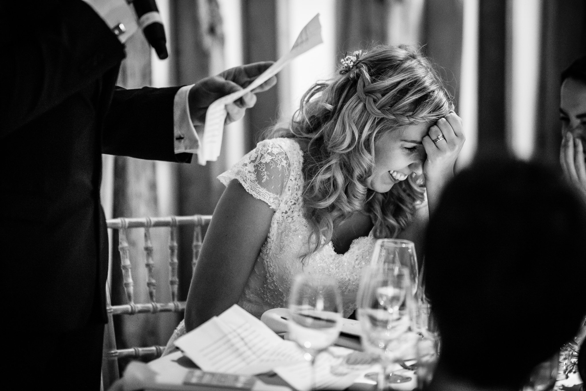  Bride laughing during the speeches 