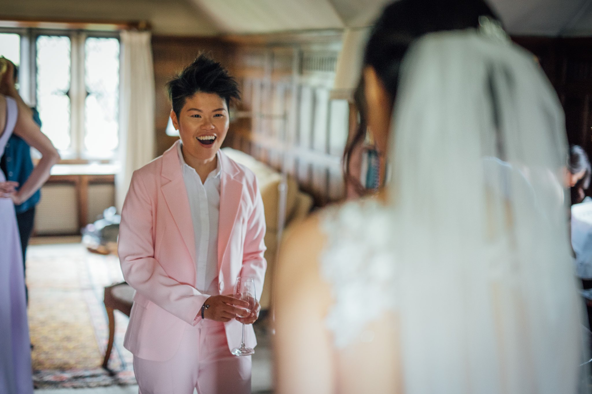  Friend of bride looks amazed at the Bride in her dress 