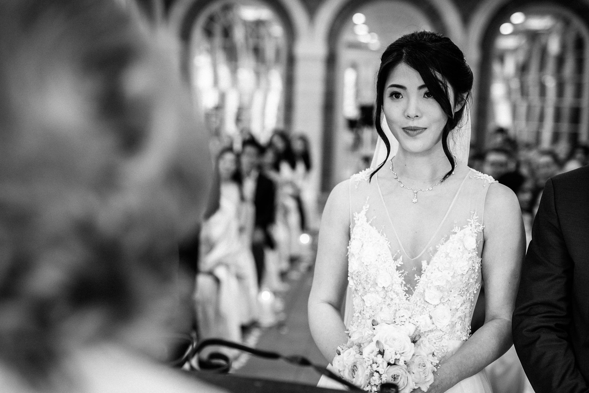  Bride standing in front of the registrar 