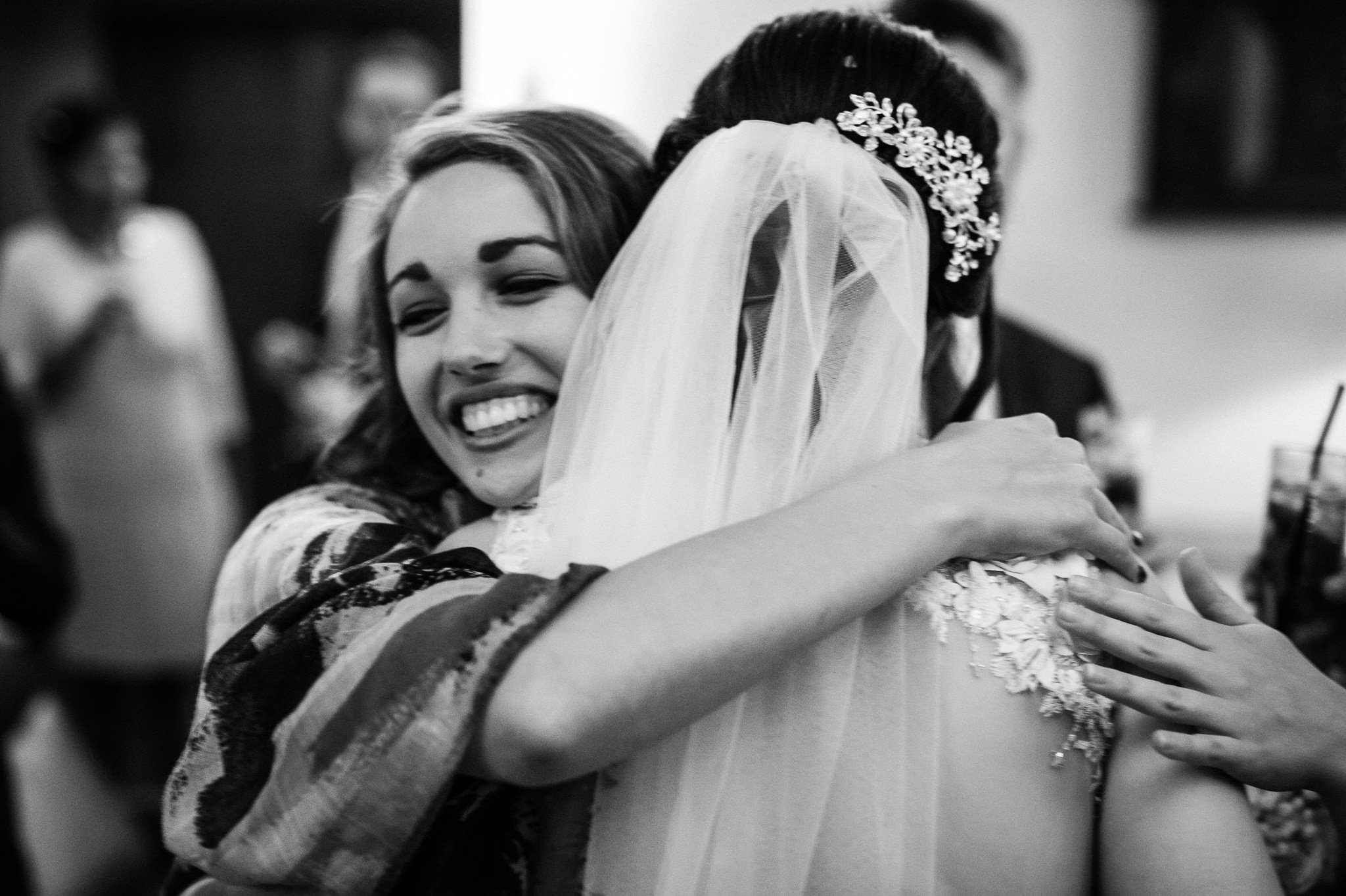  Female guest hugs the bride 