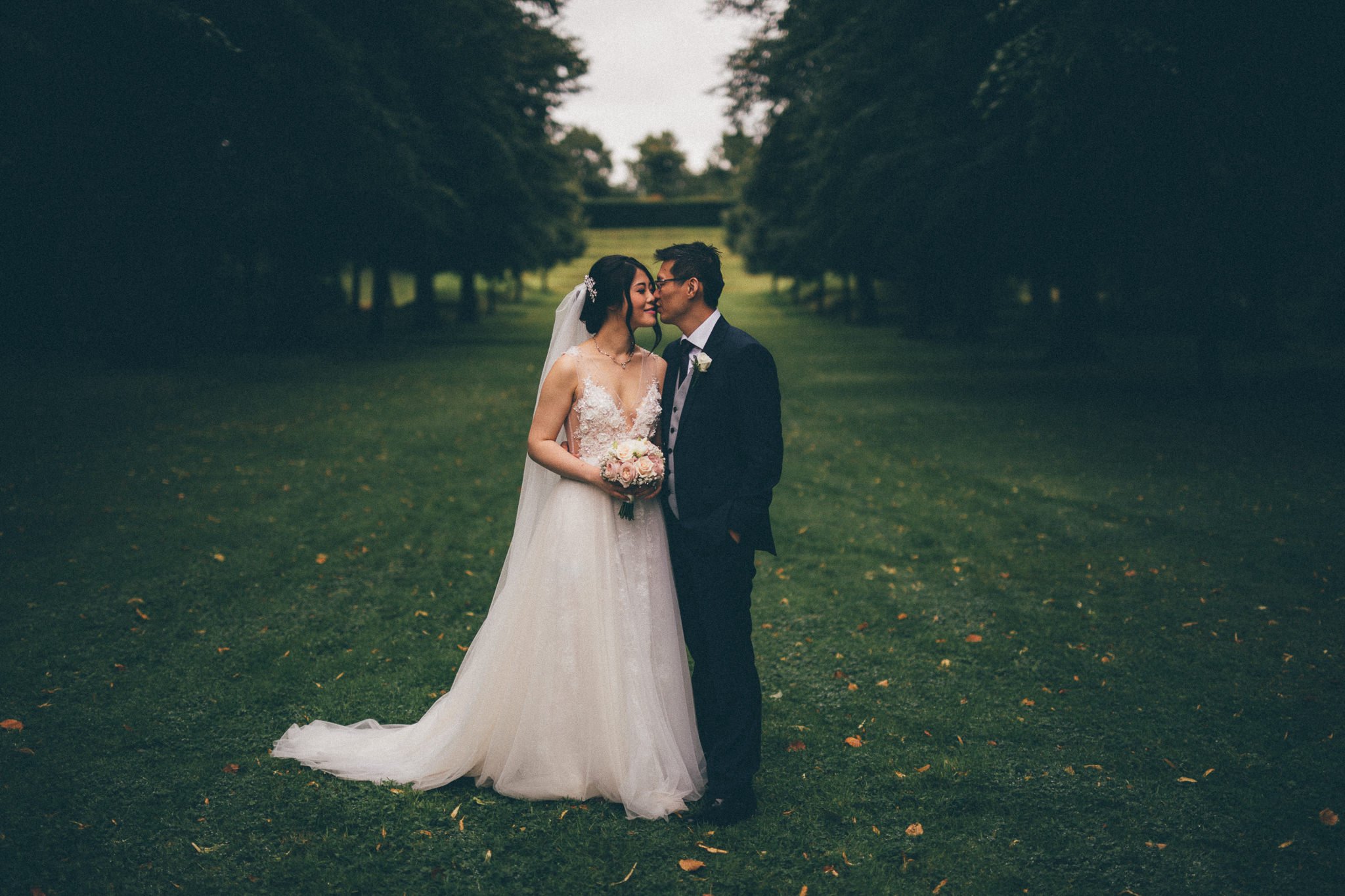  Groom kisses the Bride at Great Fosters Egham 